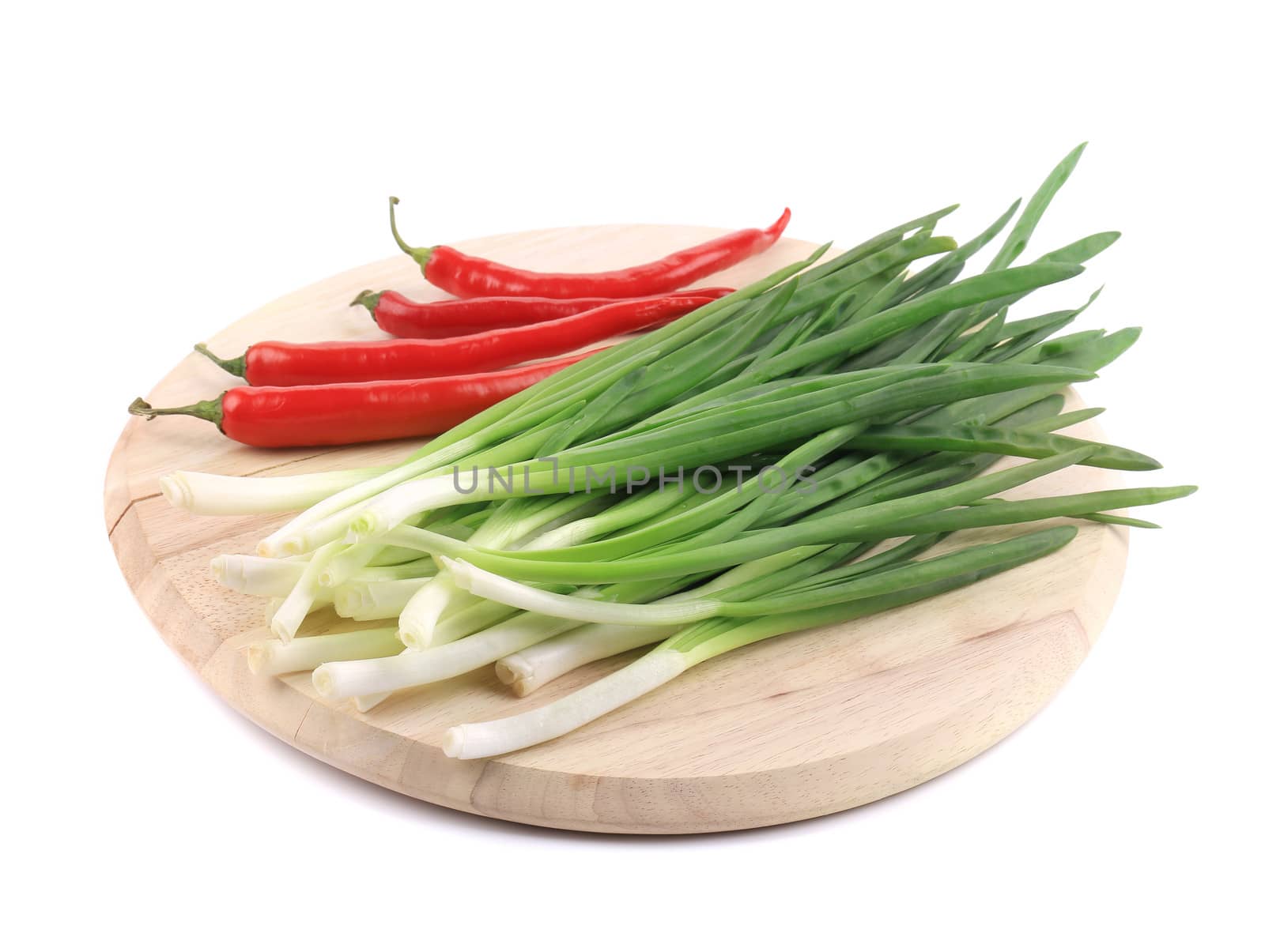 Bunch of green onion with red pepper. Isolated on a white background.