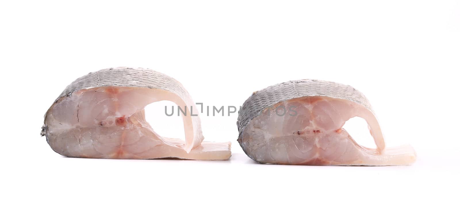 two fresh steaks of seabass. Isolated on a white background.