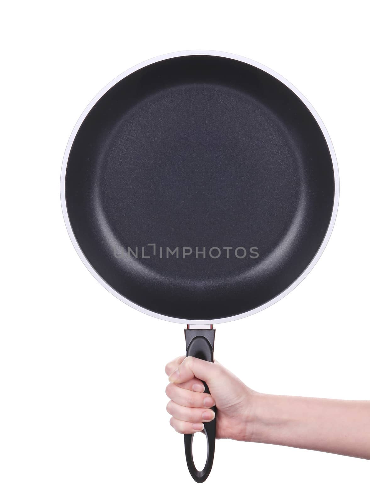 Hand holds a black frying pan. Isolated on white background