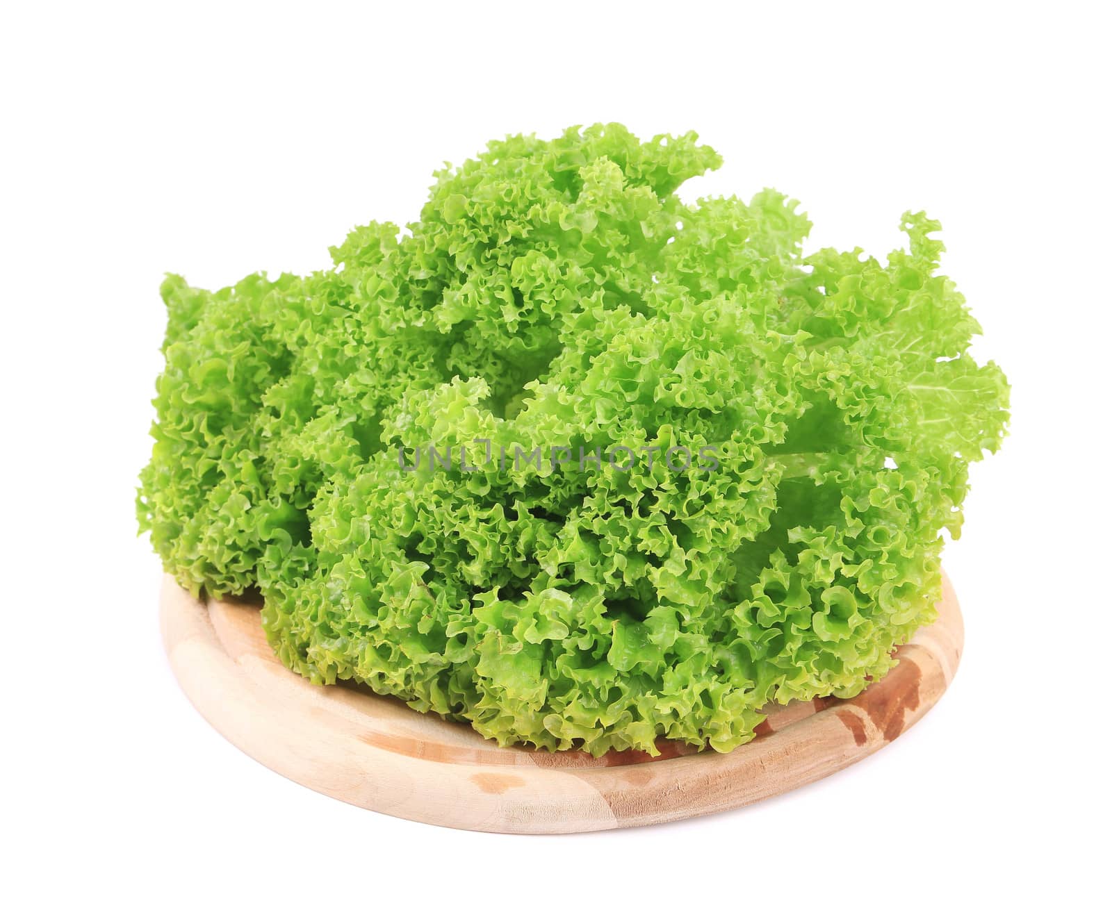 Fresh lettuce on wooden platter. Isolated on a white background.