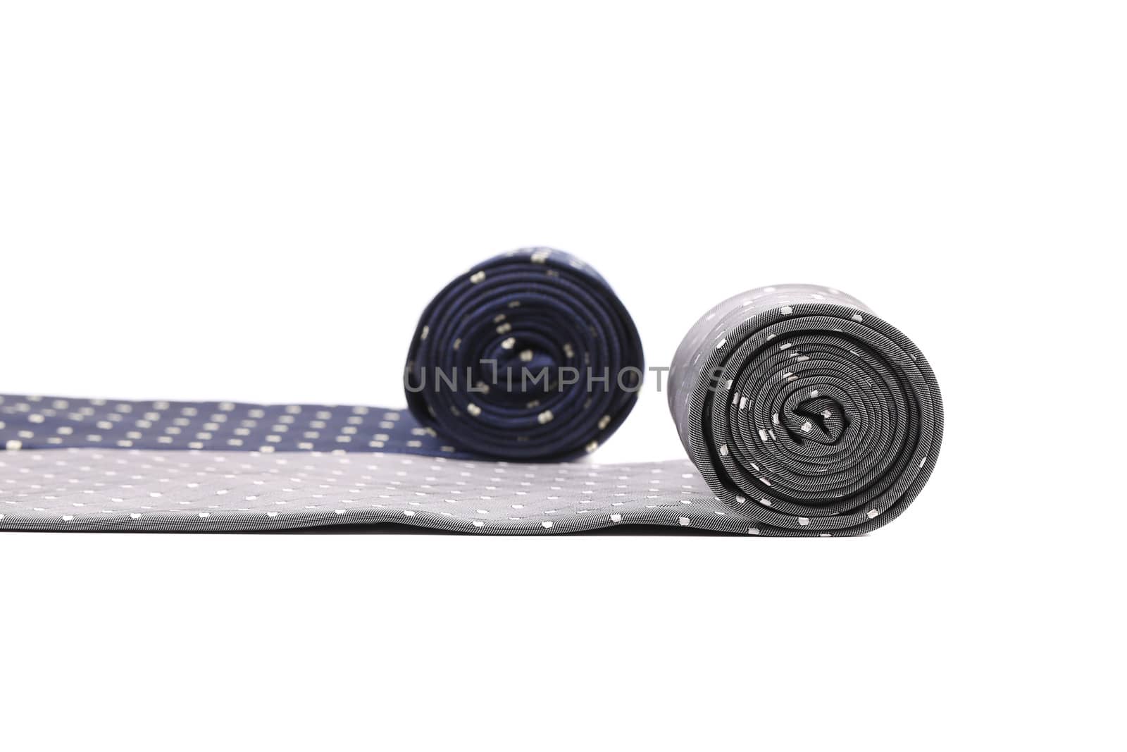 Rolled up two man's ties. Isolated on a white background.