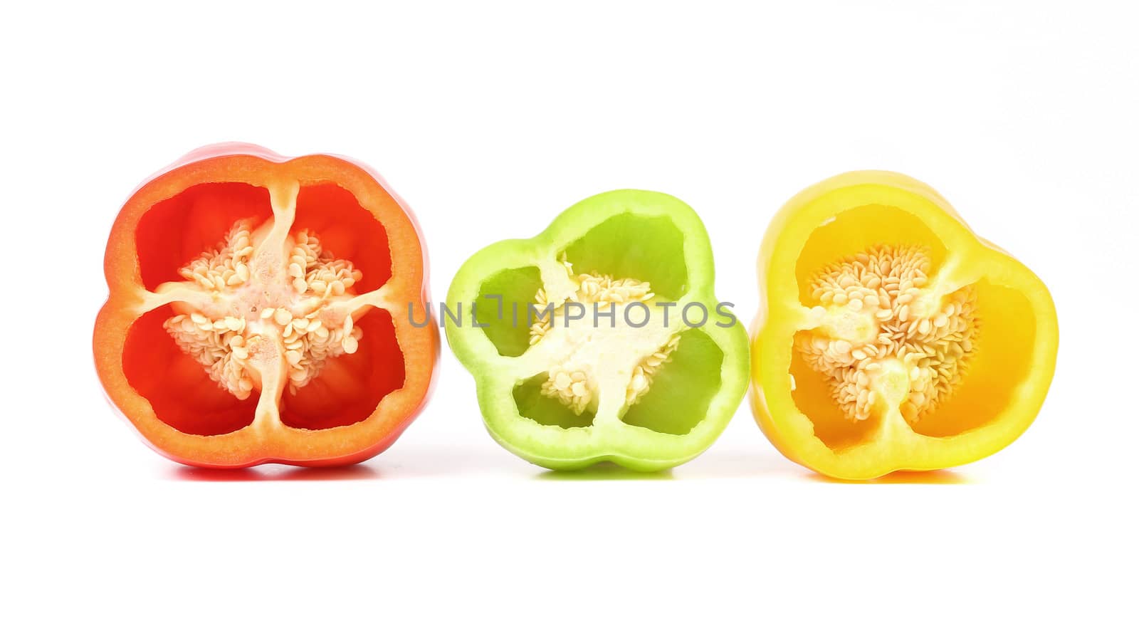 Three half of bell peppers. Isolated on a white background.