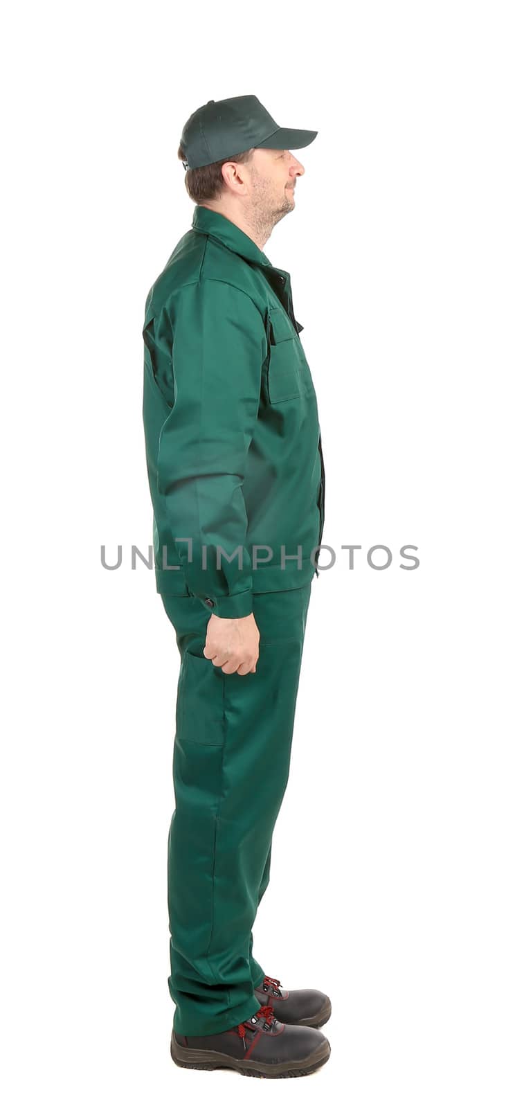 Man in green workwear. Isolated on a white background.