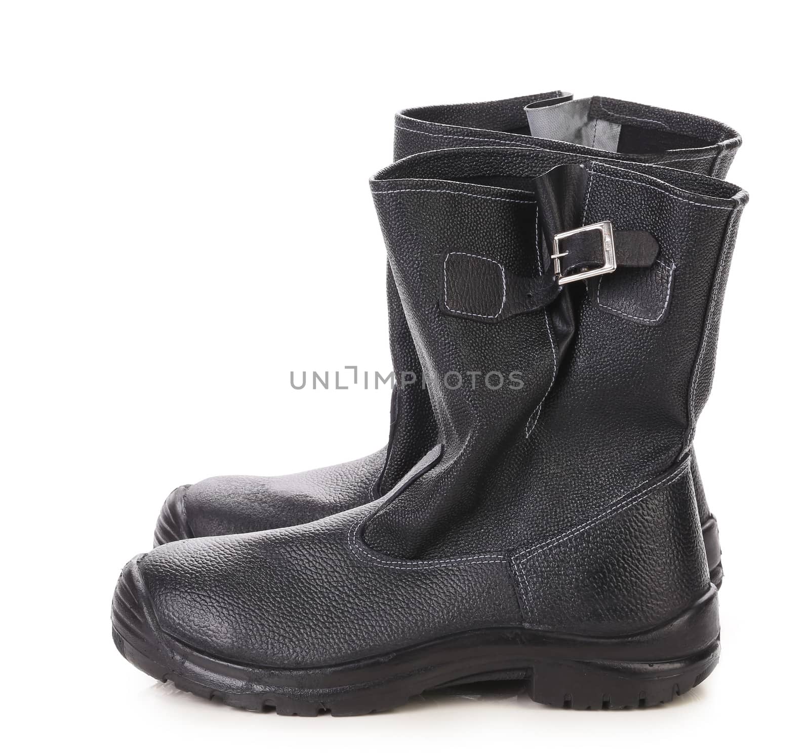 Black kersey pair of boots close up. Isolated on white background.