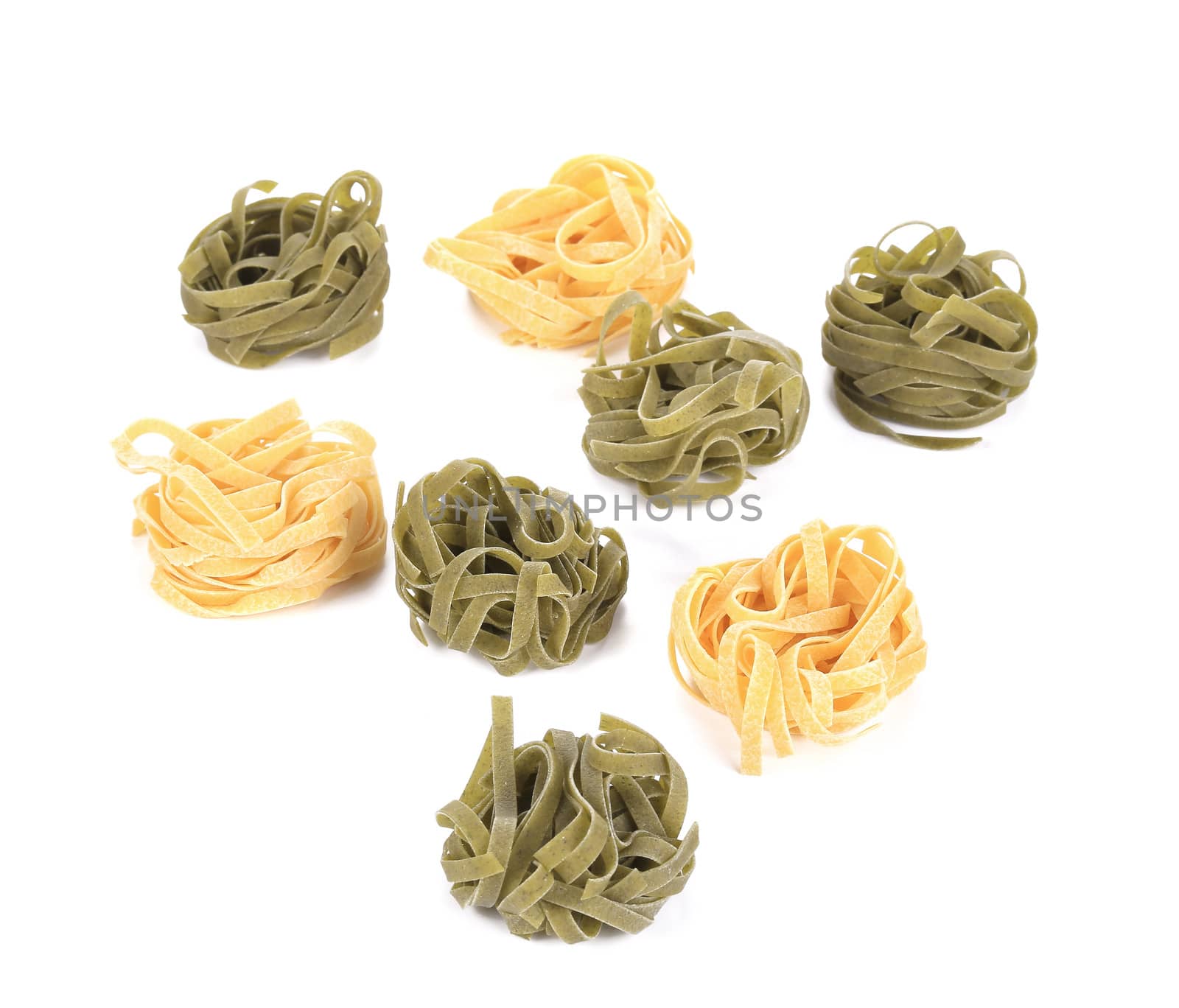 Tagliatelle paglia italian pasta. Isolated on a white background.