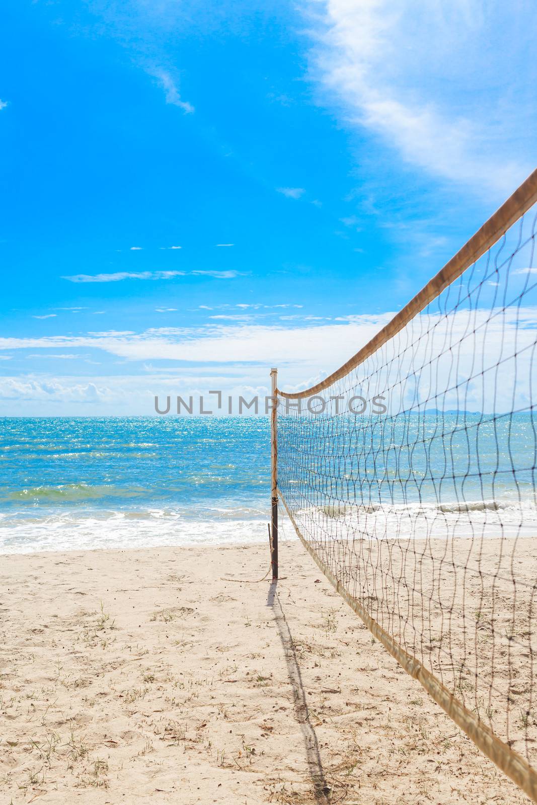 beach volleyball net on the beach with blue sky