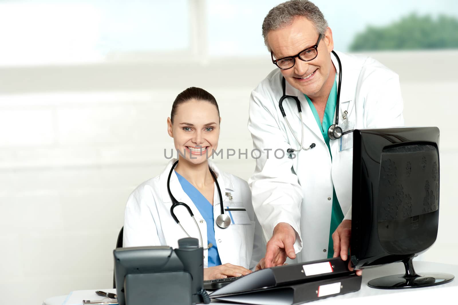 Two cheerful doctors at hospital by stockyimages