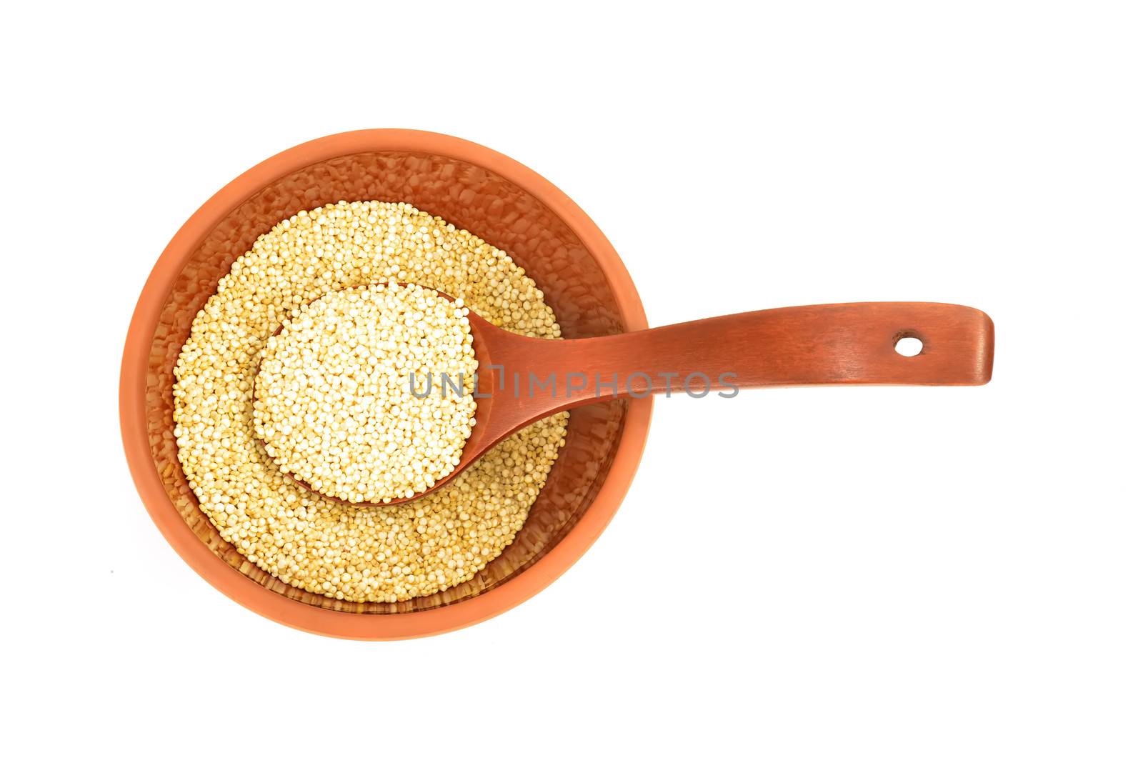 Chenopodium quinoa in clay bowl and wooden spoon by Carche