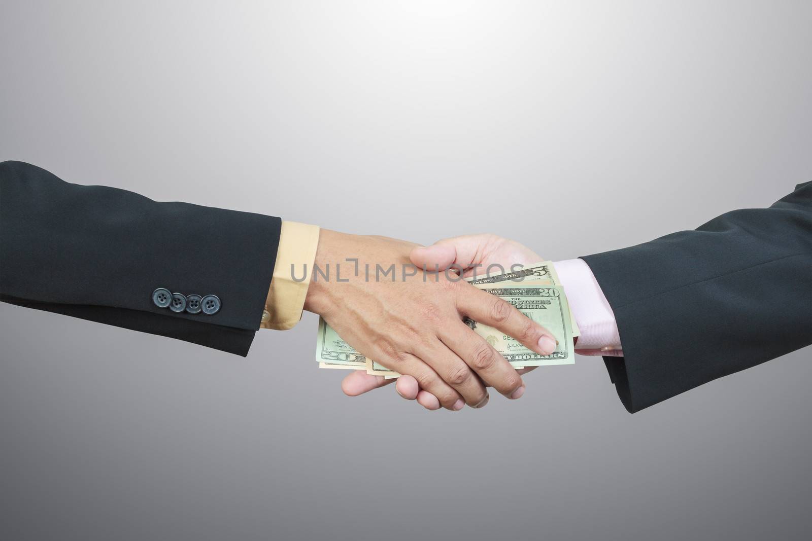 businessman hand and money to other for corruption concept
