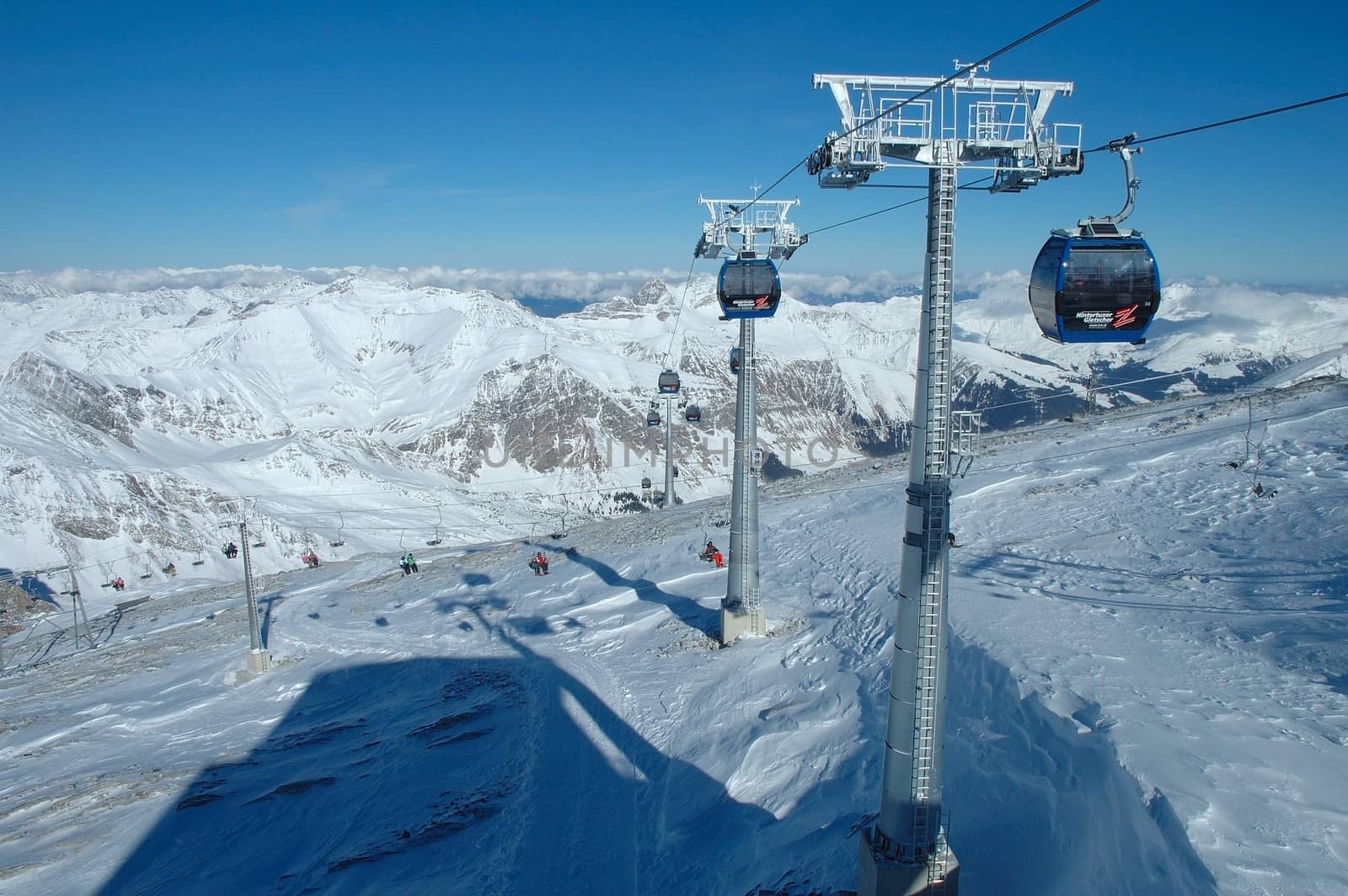 HINTERTUX, AUSTRIA - FEBRUARY 06: Peaks and ski lifts nearby Hintertux in Zillertal valley in Austria 06.02.2014