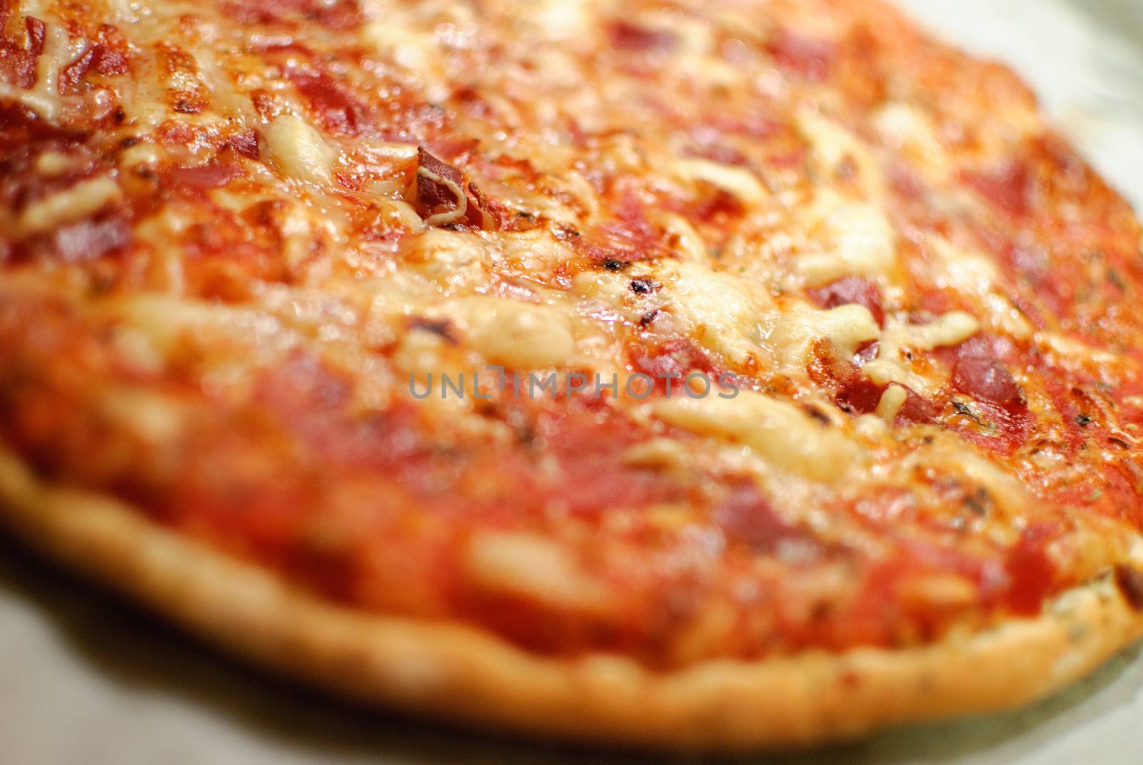 Detail of homemade pizza, selective focus (shallow depth of field)