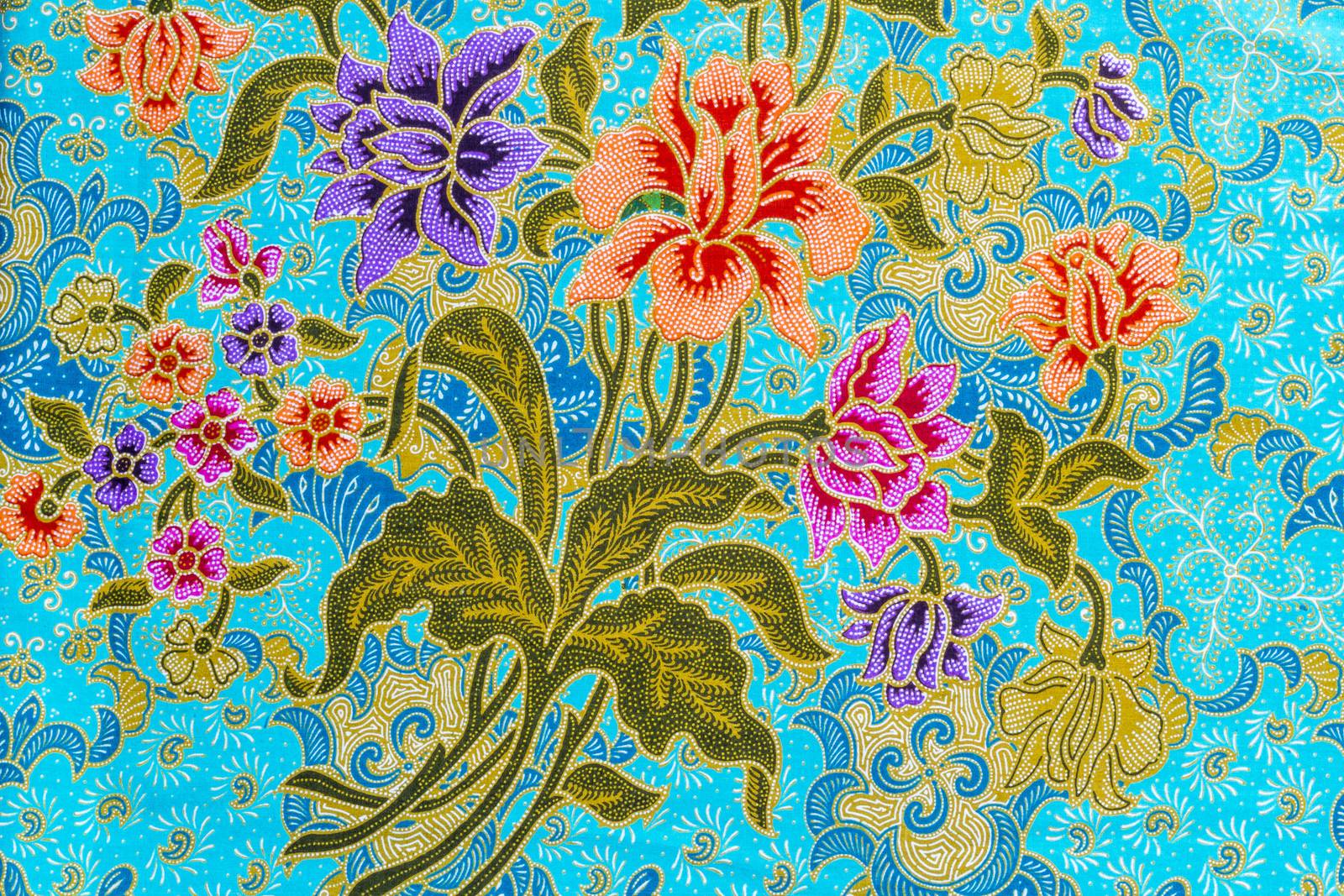 Beautiful colorful flowers pattern on batik background