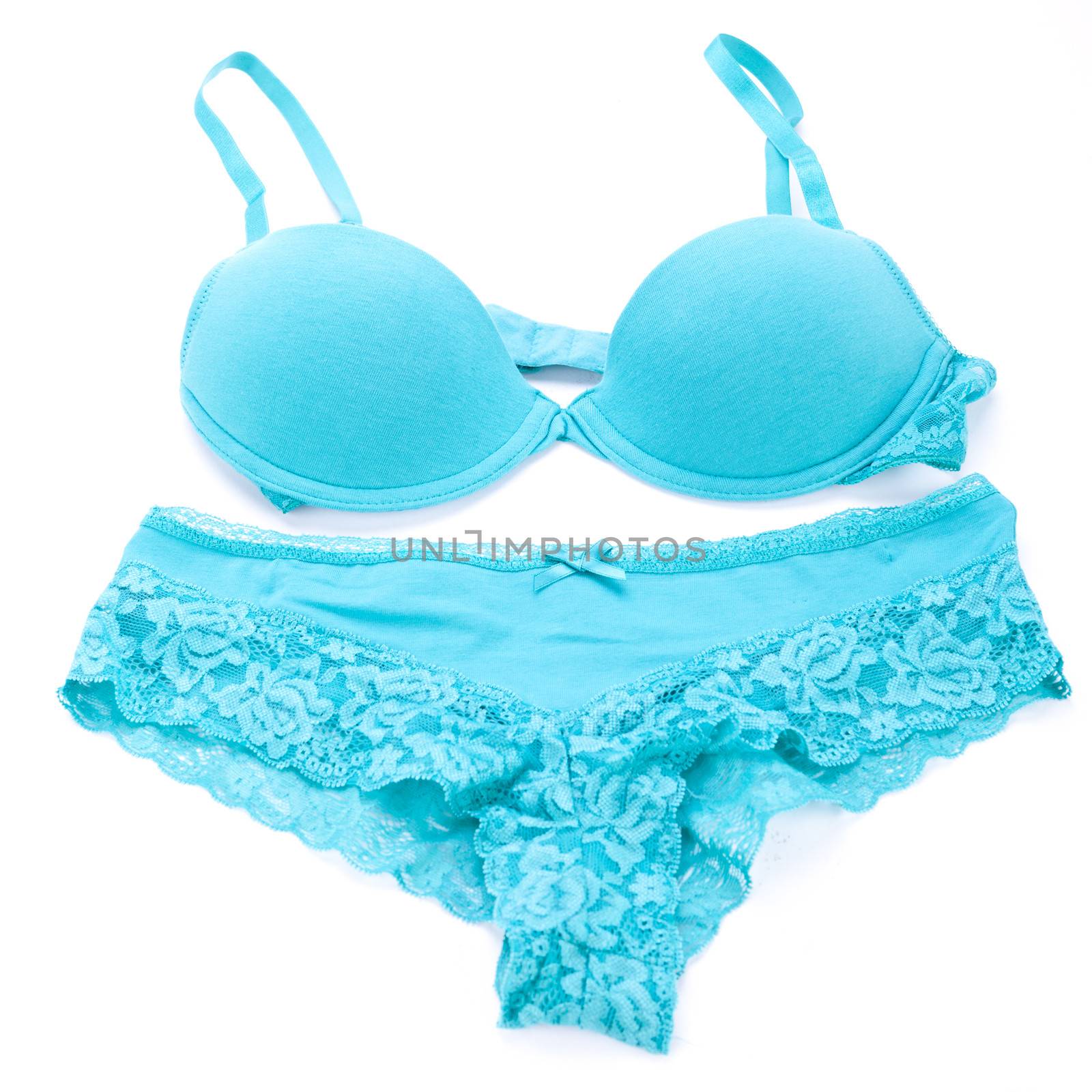 Set of sexy turquoise blue lingerie with a bra and pair of cute frilly pants with floral patterned lace isolated on white