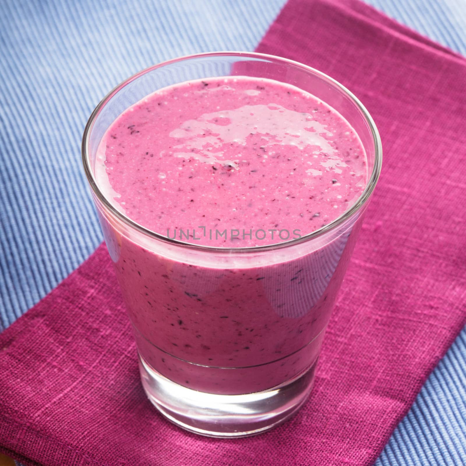 blueberry smoothie in a glass on the table