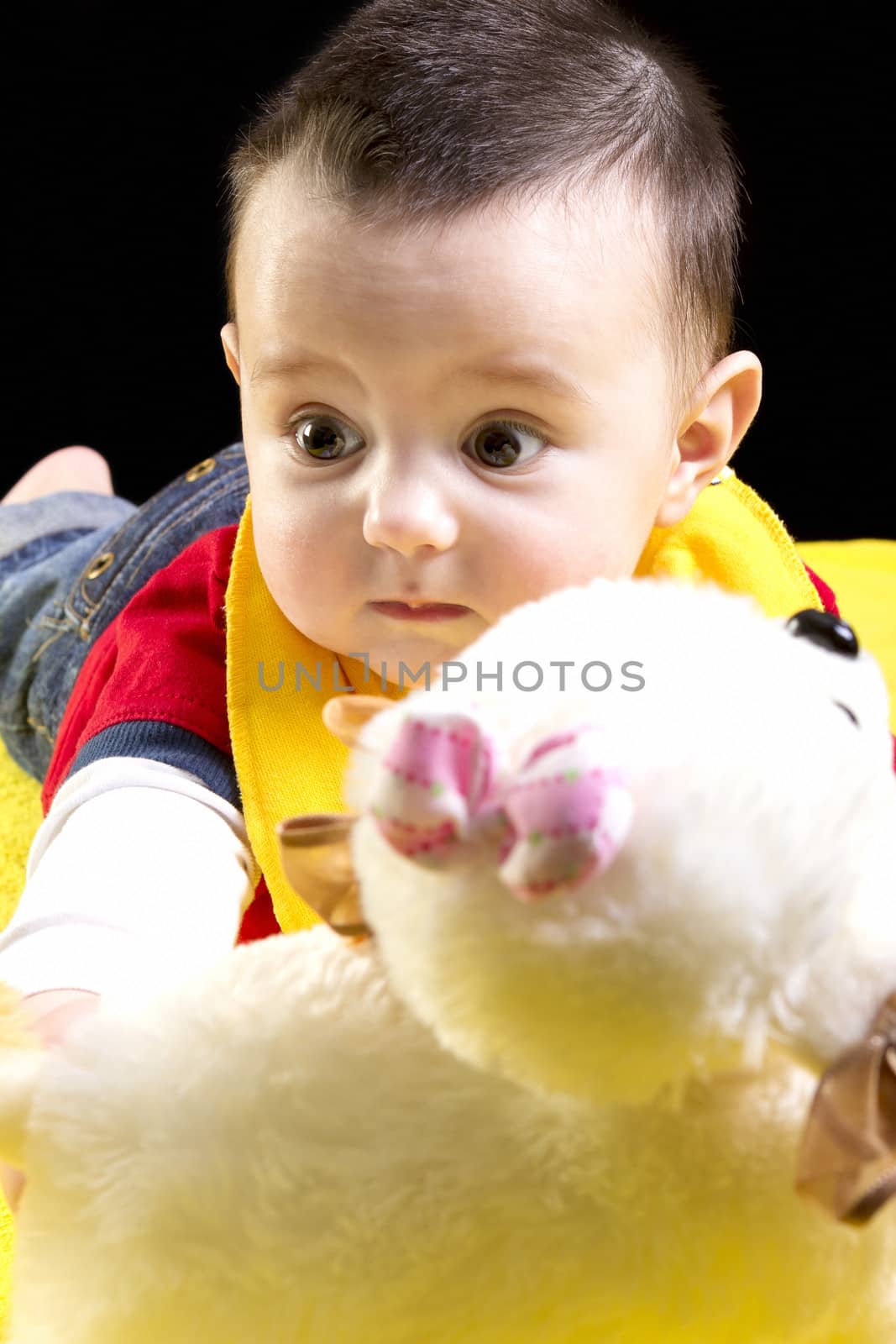 Baby boy on yellow blanket