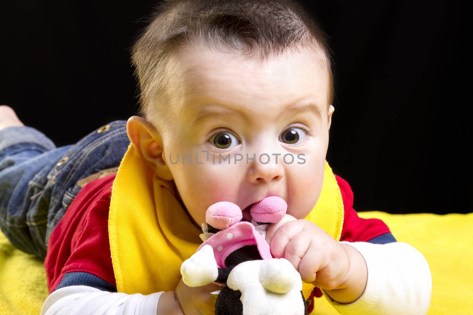 Baby boy on yellow blanket