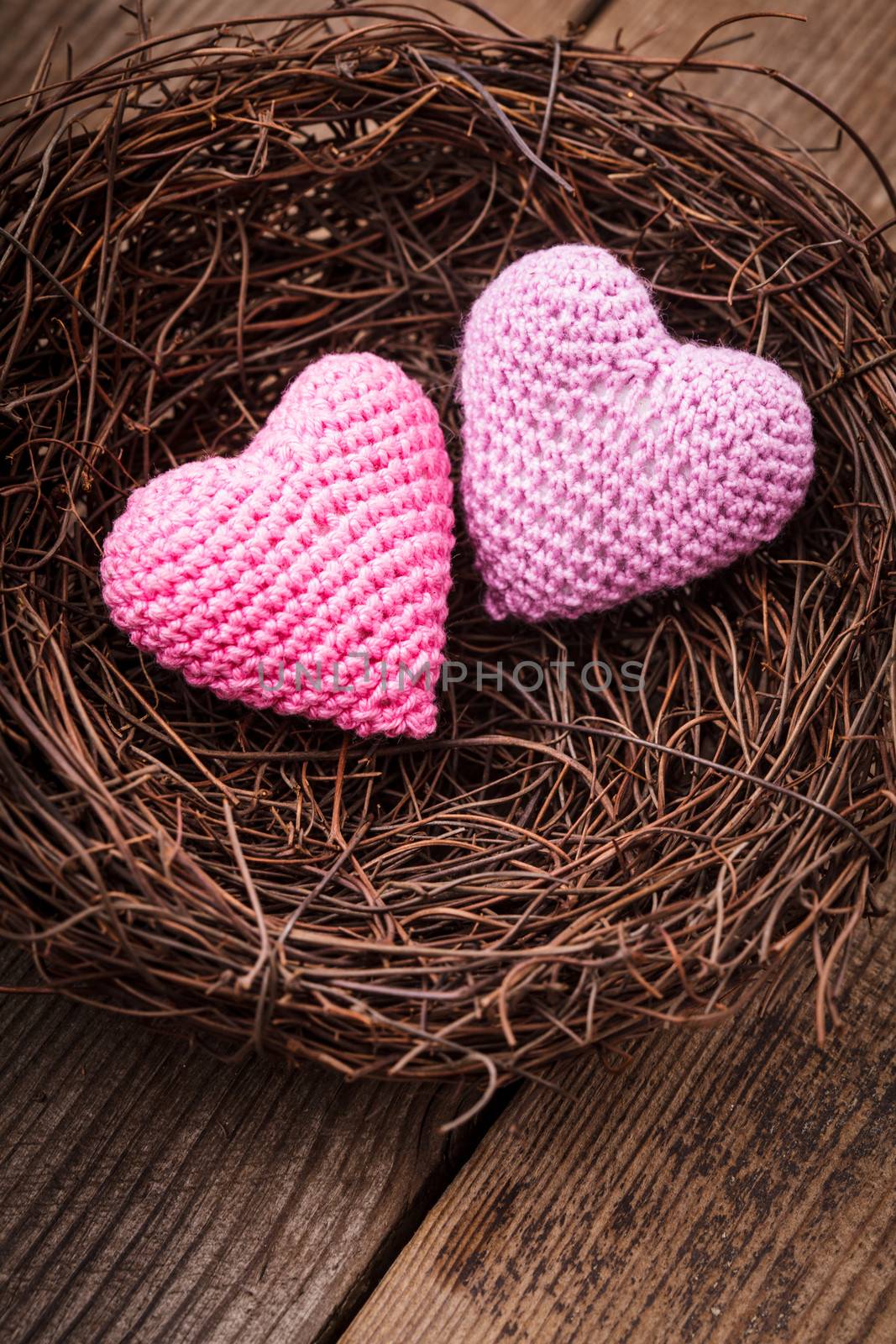 Little cozy nest with two crochet hearts. Valentine's day decorations