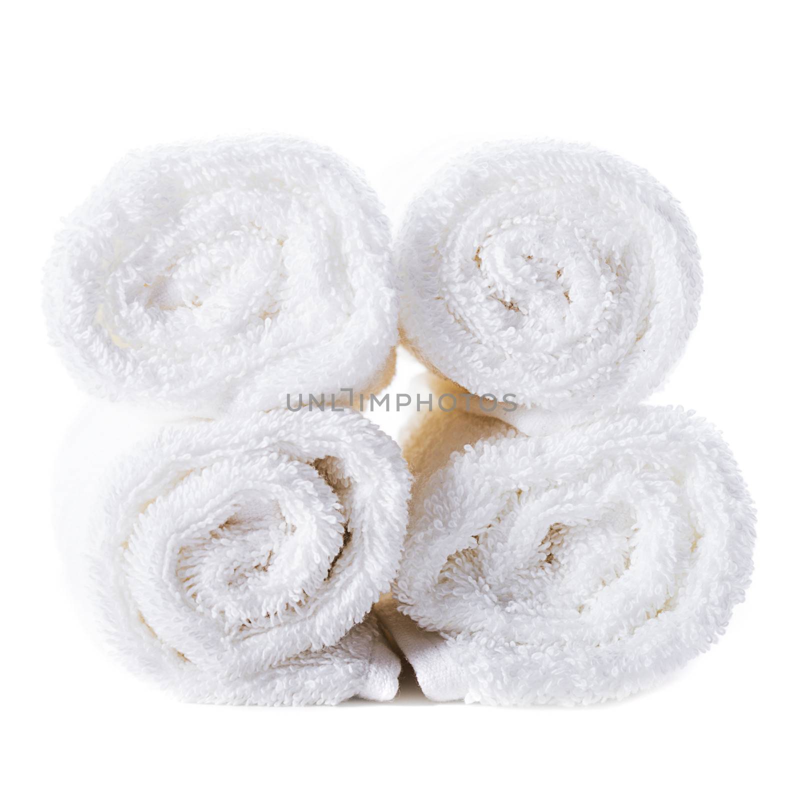 White spa towels pile isolated on white background