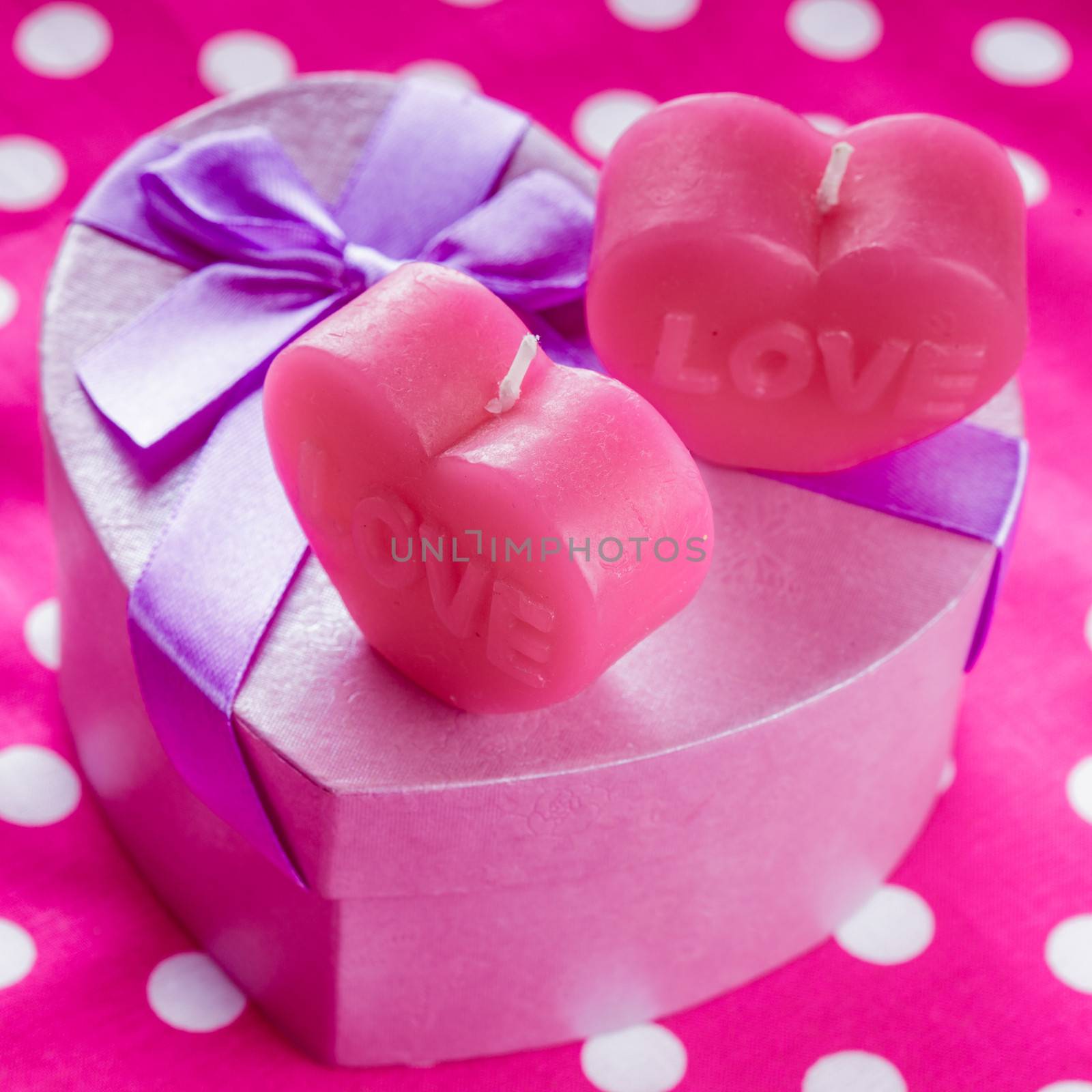 Red scented candle in the shape of heart and gift box