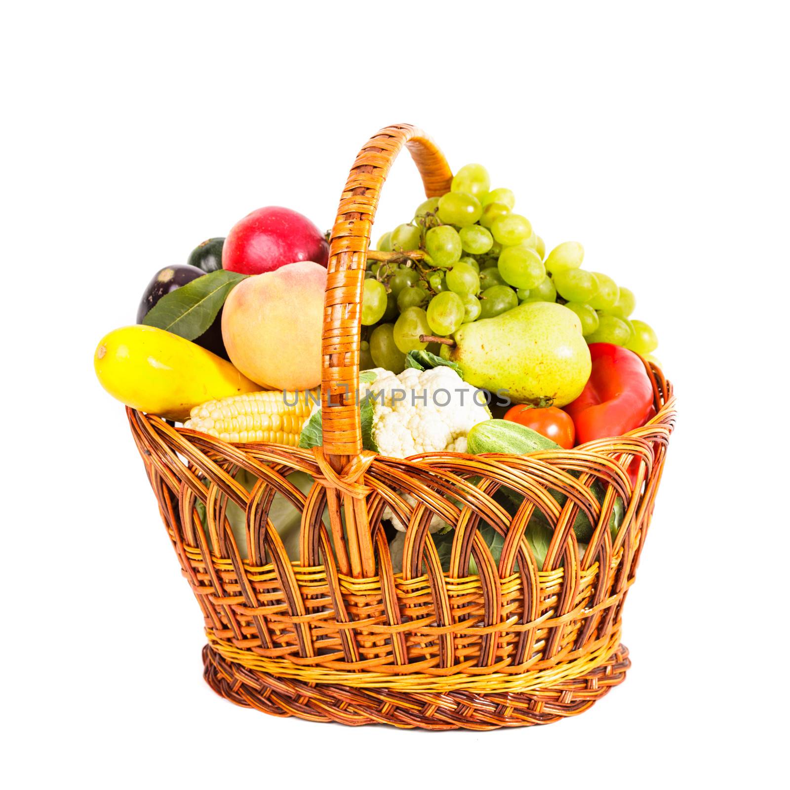 Basket of vegetables and fruits isolated on white