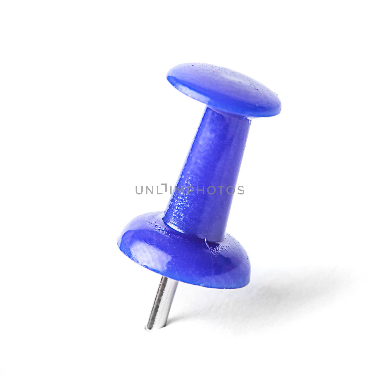 Pushpin attached in on white background isolated