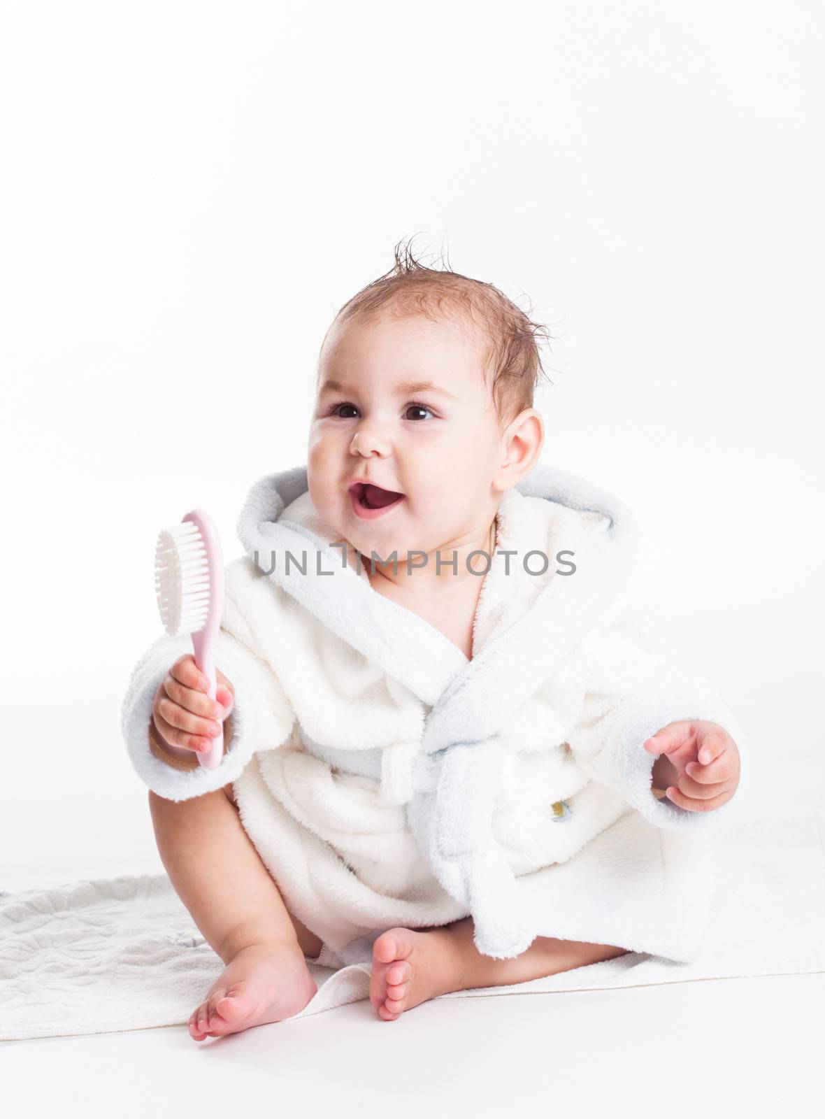 Baby after bath with comb and wet head