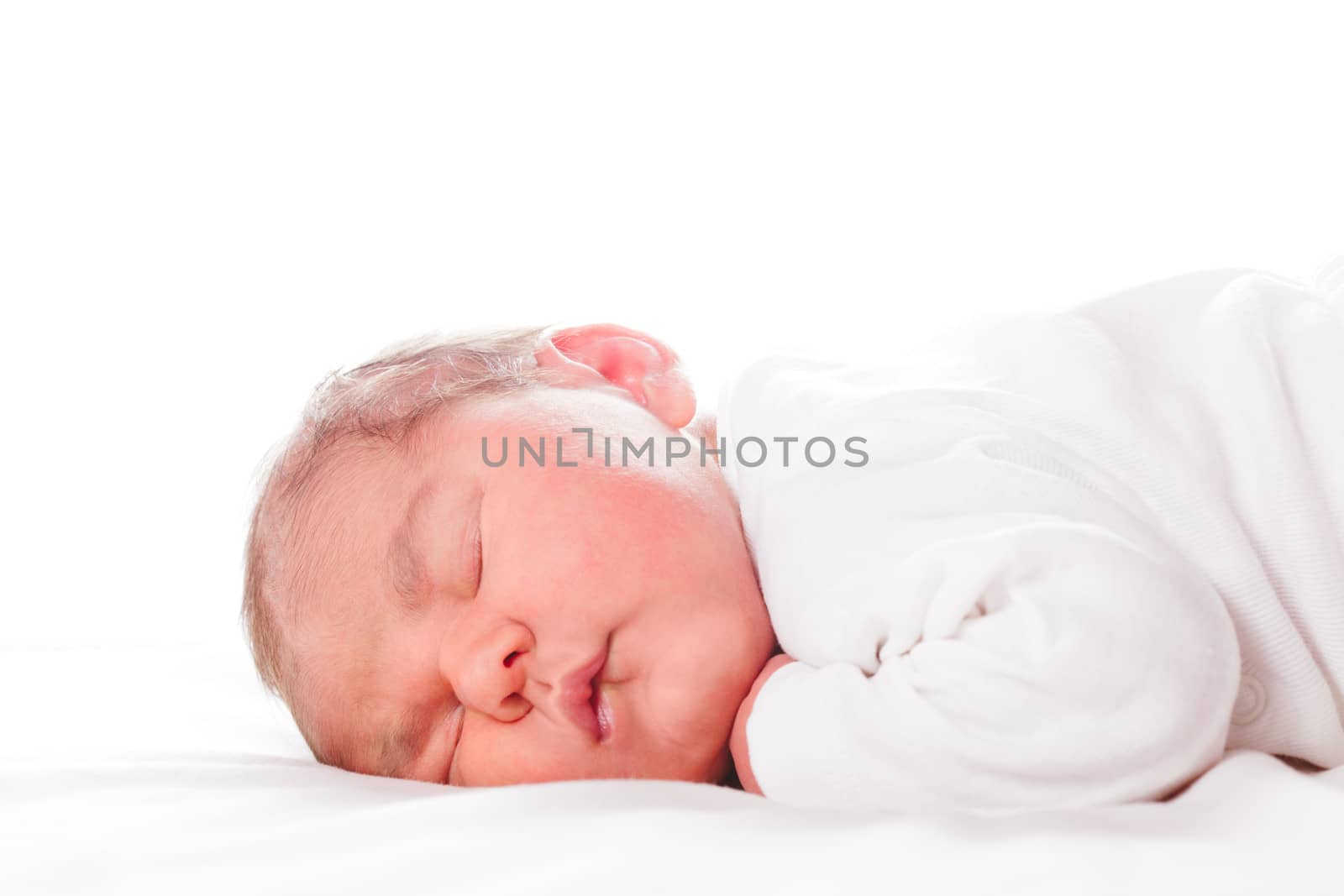 Five days old infant, sleeped on the white