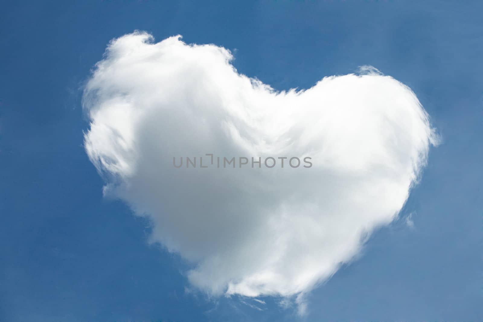 The big cloud in form of a heart in the summer sky