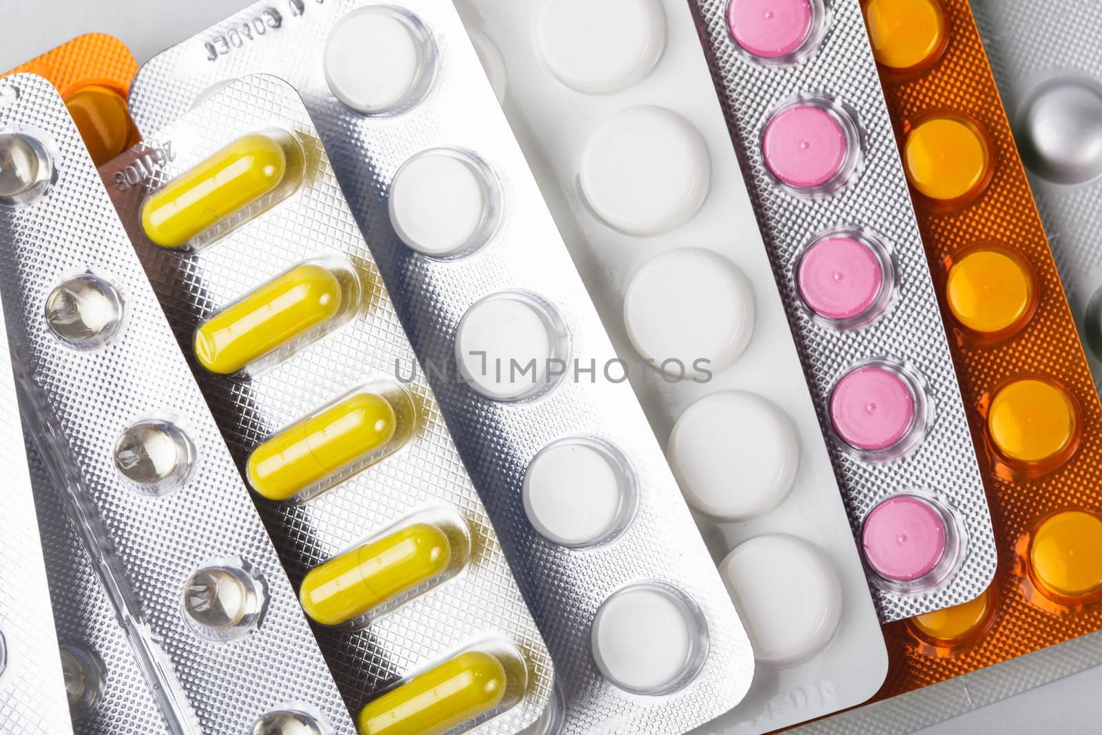 A variety of tablets in packs on background, treatment