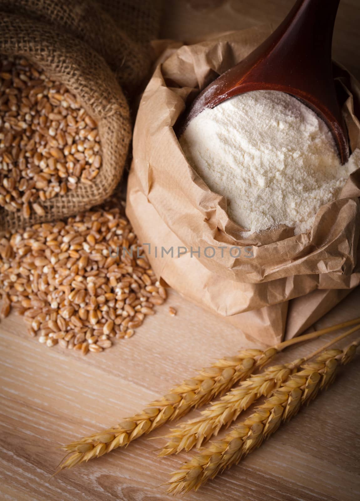 Meal in sack with wooden spoon closeup