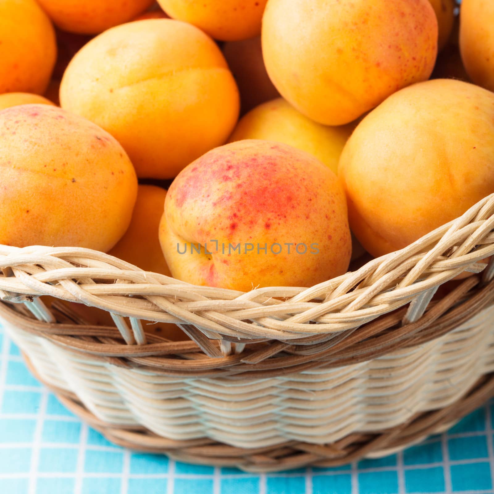 Apricots in a basket on the table