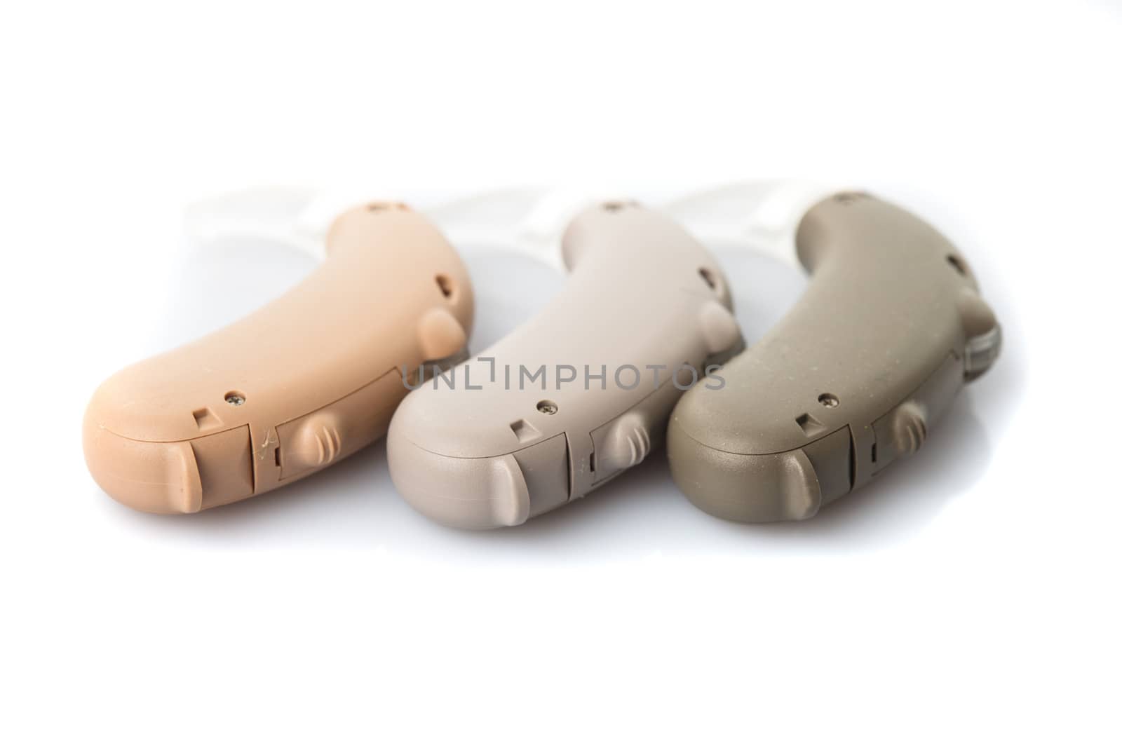 Digital hearing aids in the color of the skin