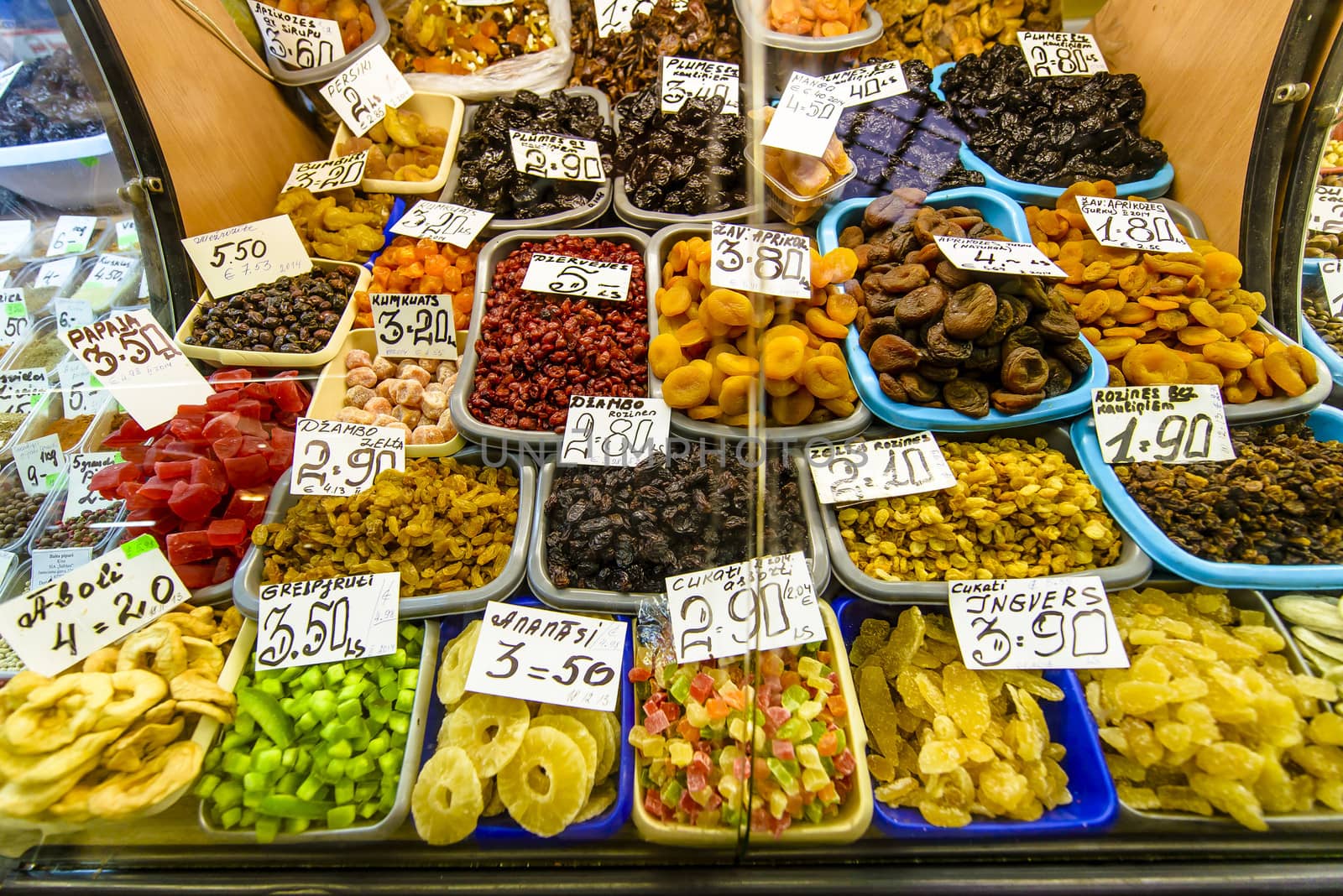 Dried multi colour fruit on the exotic market with visible prices, many different fruits.