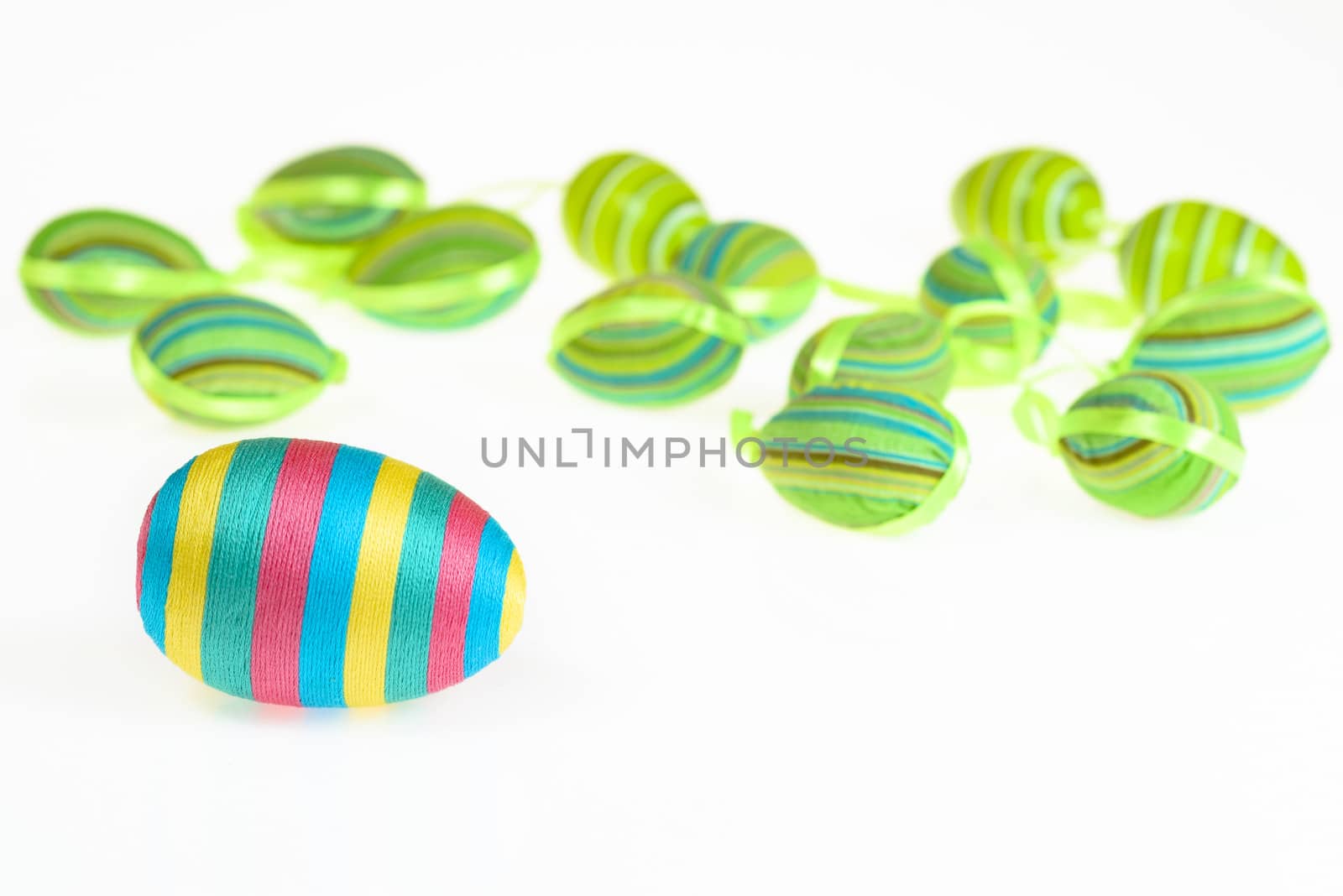 Easter decorated striped eggs on white background. by westernstudio