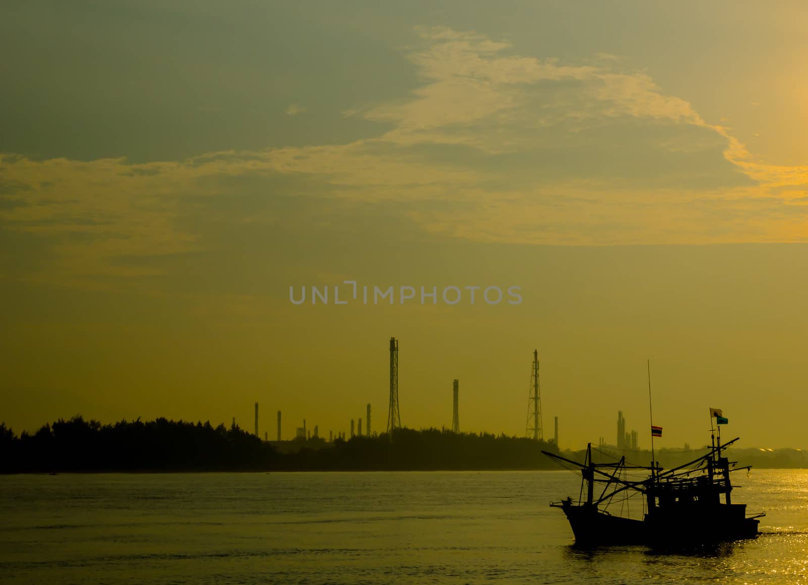 Refinery heavy industrial  effect with lifestyle of small boat fisherman