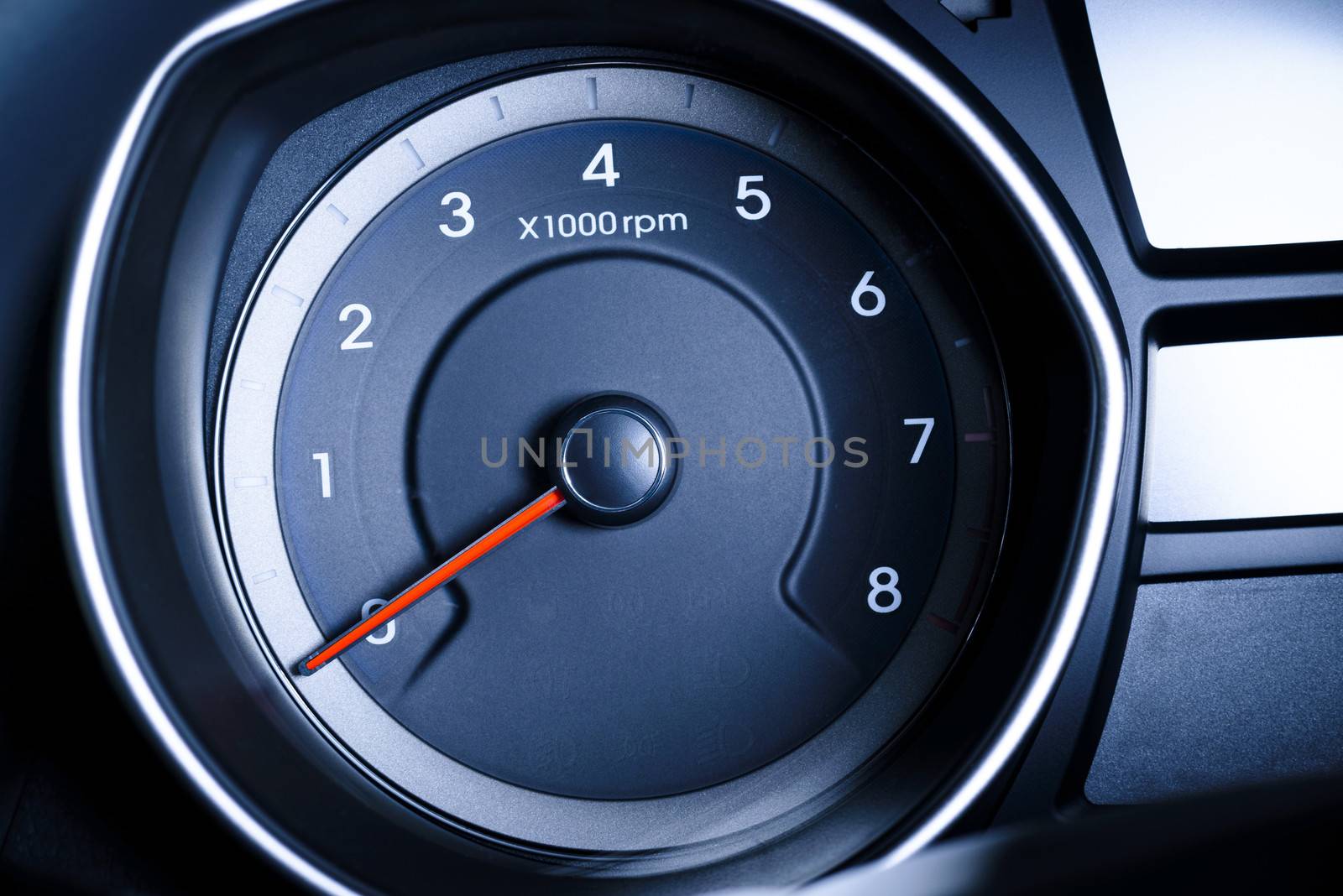 Fragment of instrument panel of car speedometer, tachometer with  with visible symbols of instrument cluster, with warning lamps illuminated. by westernstudio