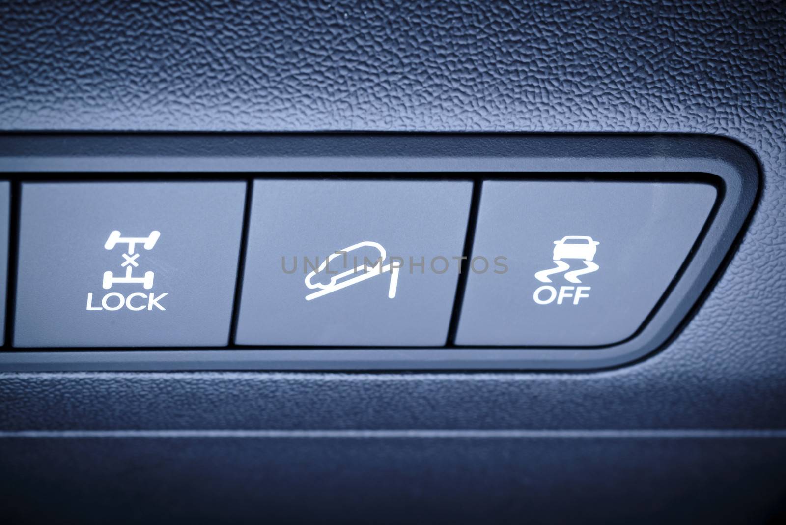 Vehicle, car interior - fragment of panel overview, all wheels, four-wheel, 4WD drive buttons and other safety systems switching buttons.