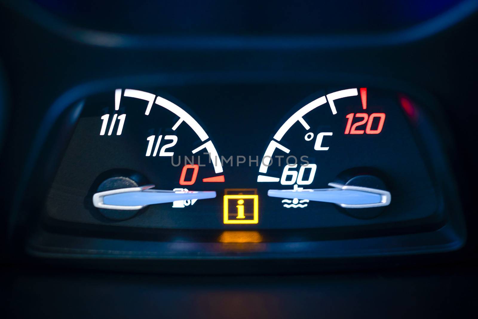 Car, vehicle interior with visible Fuel, gas gauge and Engine coolant temperature gauge with illuminated Information warning lamp visible.