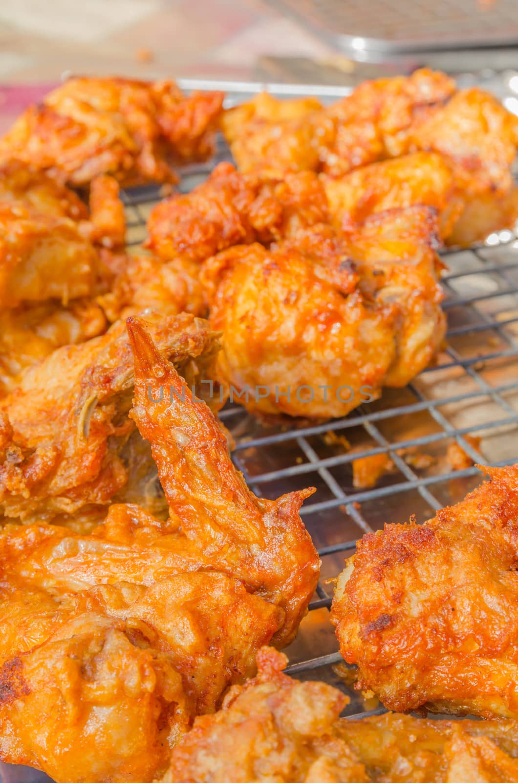 Hot fried chicken wings sale in the fresh food market at Rayong Thailand