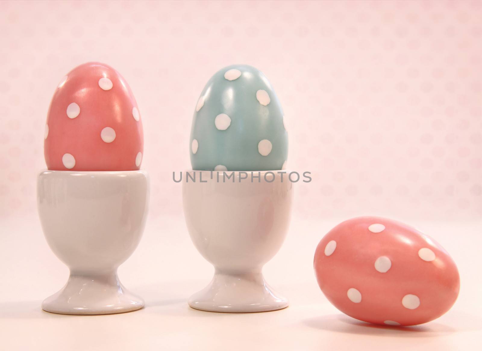 Colorful eggs in white cups by Sandralise