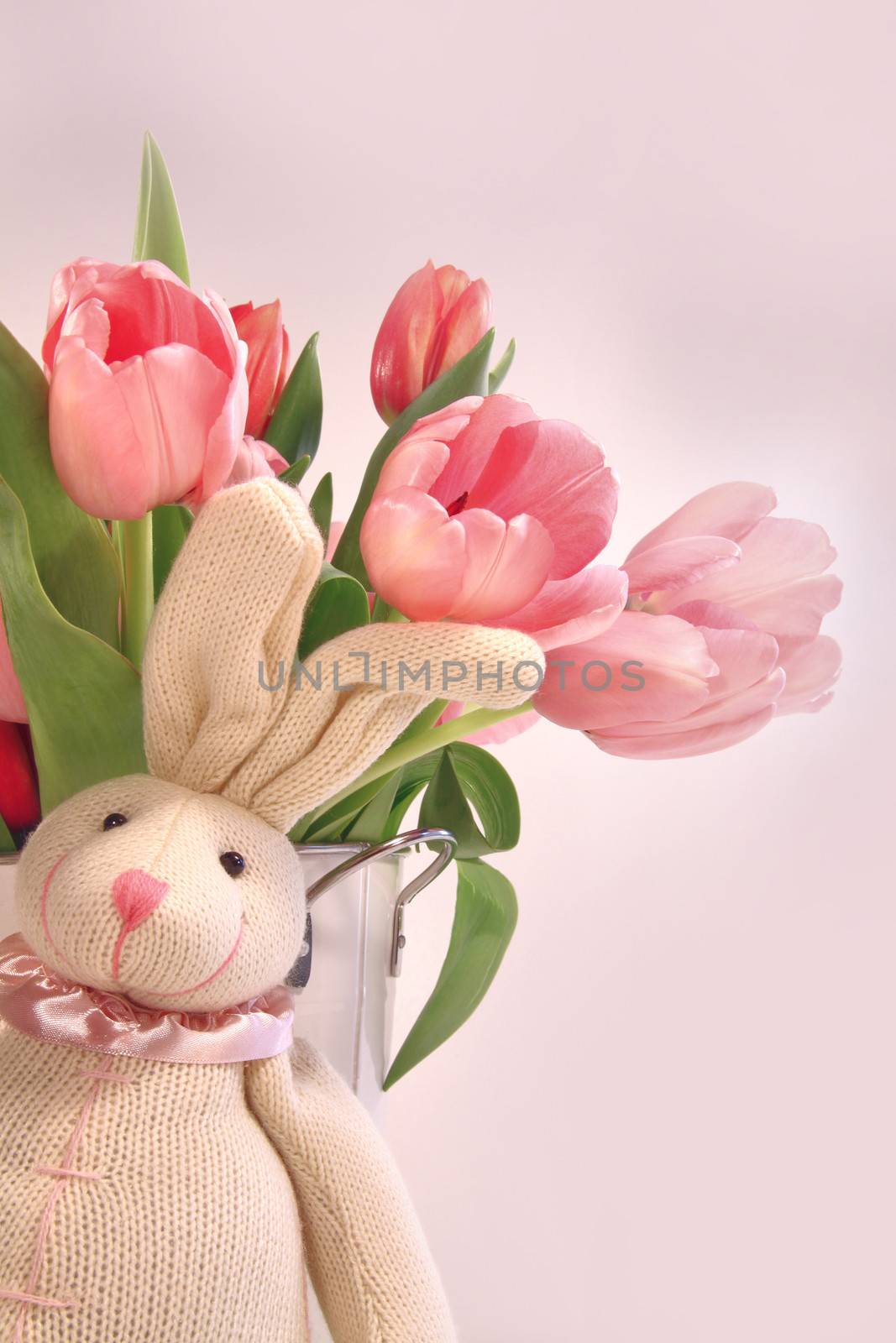 Easter decoration with rabbit and pink tulips