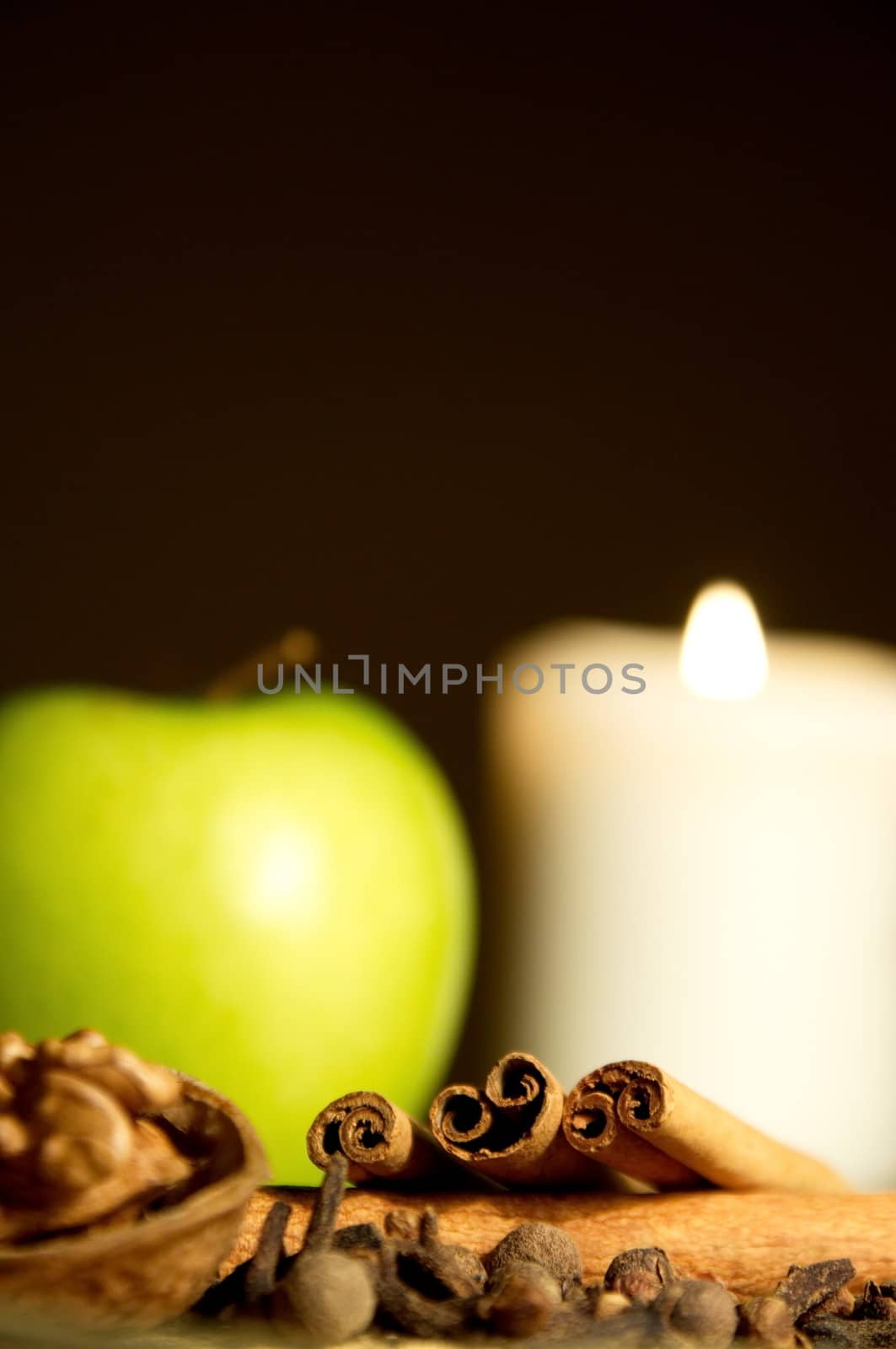 Green apple, cinnamon, walnut and a candle by anderm