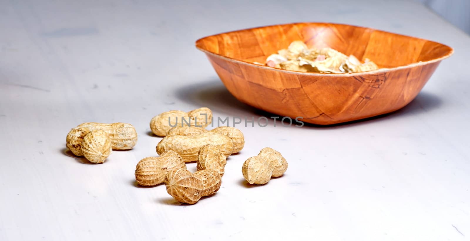 Peanuts in a brown bowl