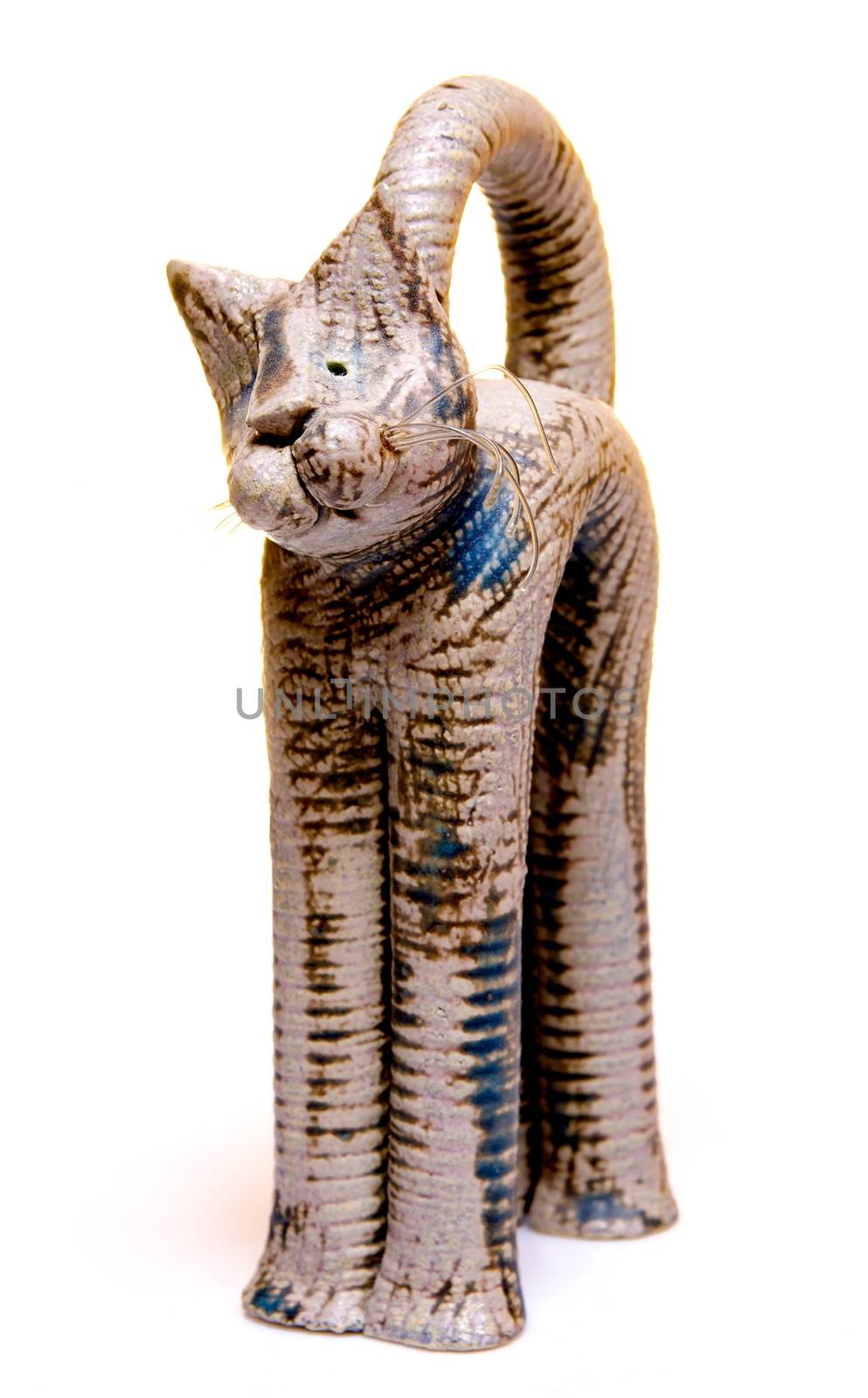 Cat figurine on white background by anderm