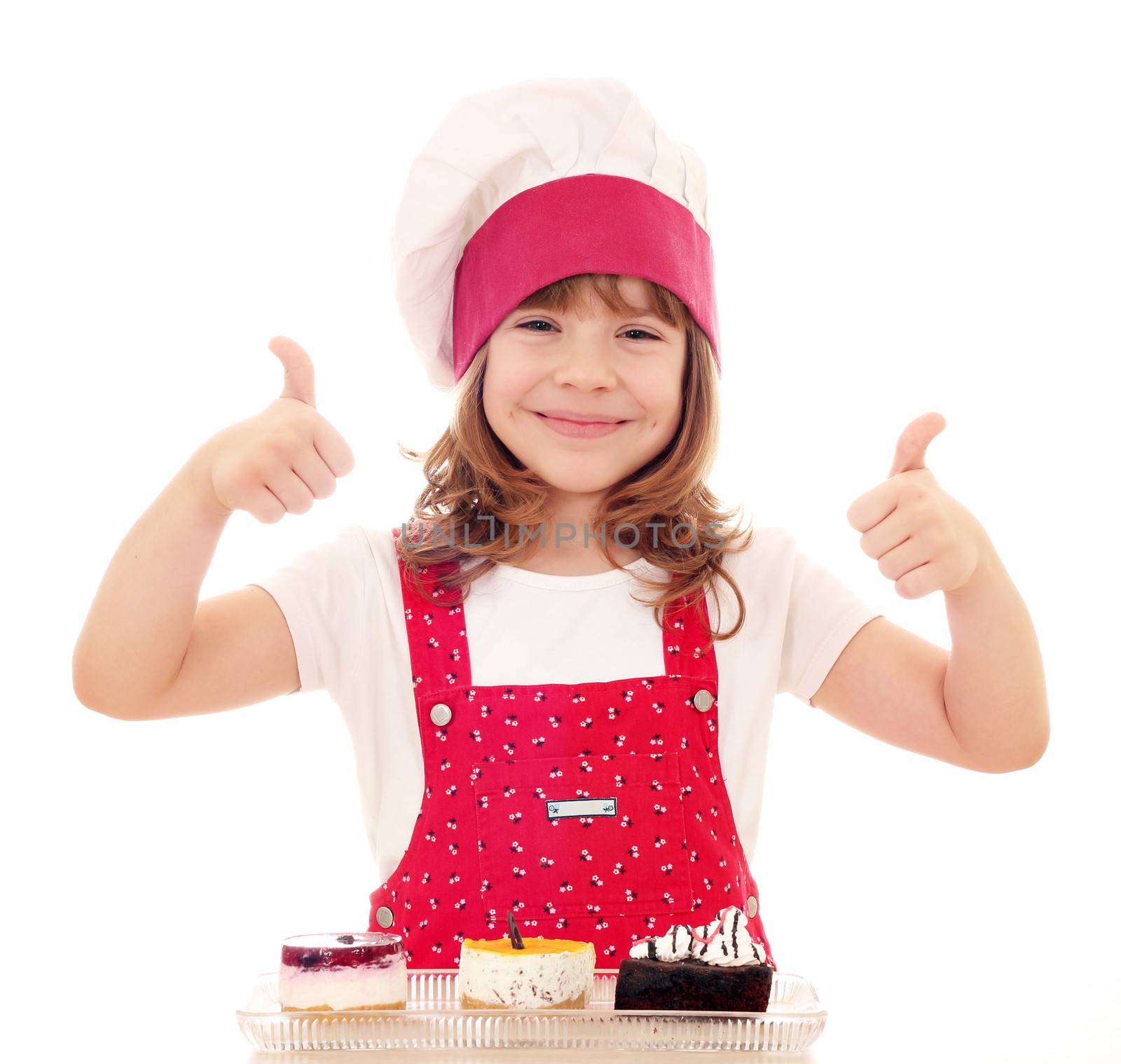 happy little girl cook with thumbs up and cakes by goce