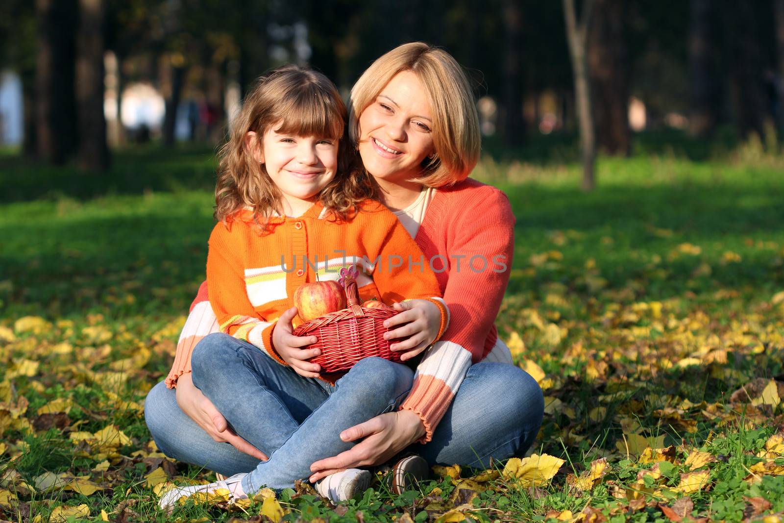 happy mother and daughter in park by goce