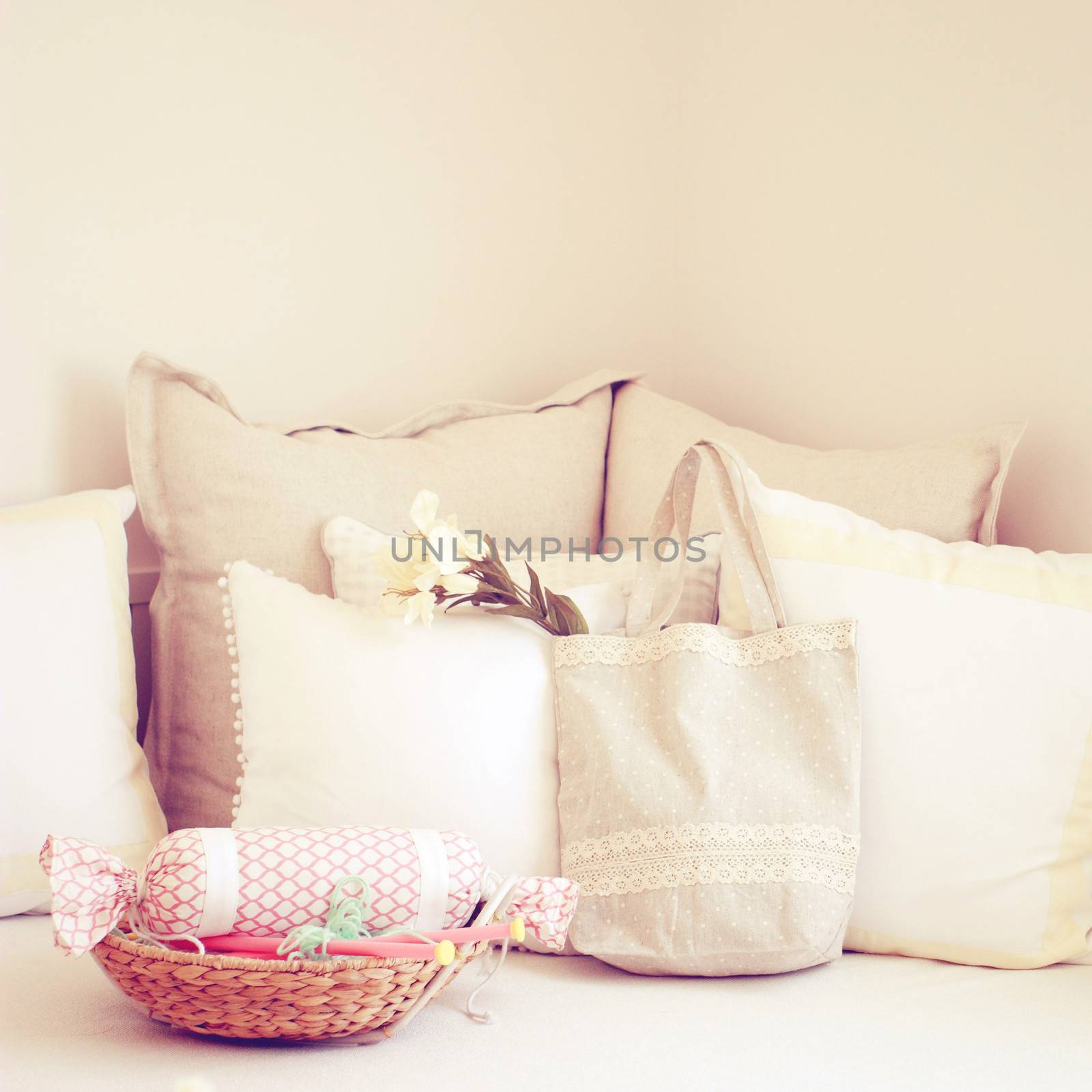 Knitting needles in basket and cute tote bag on the bed with ret by nuchylee