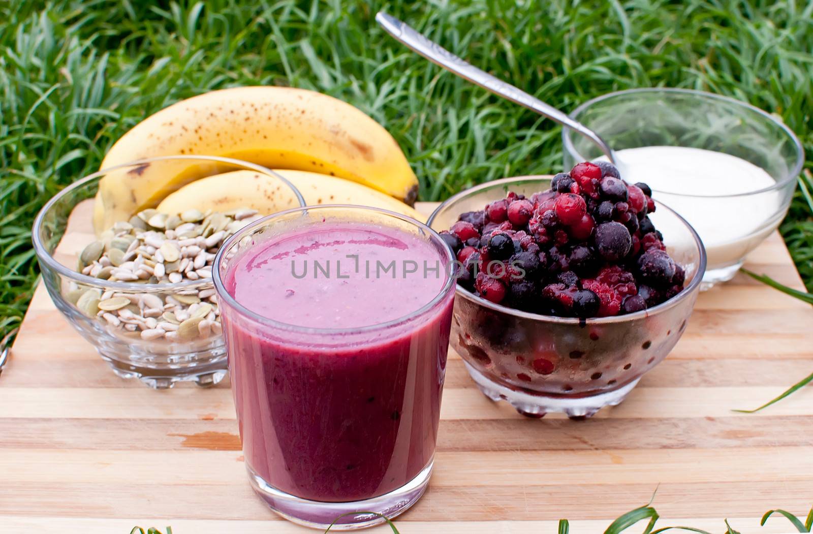 healthy berries juice smootie on wooden board