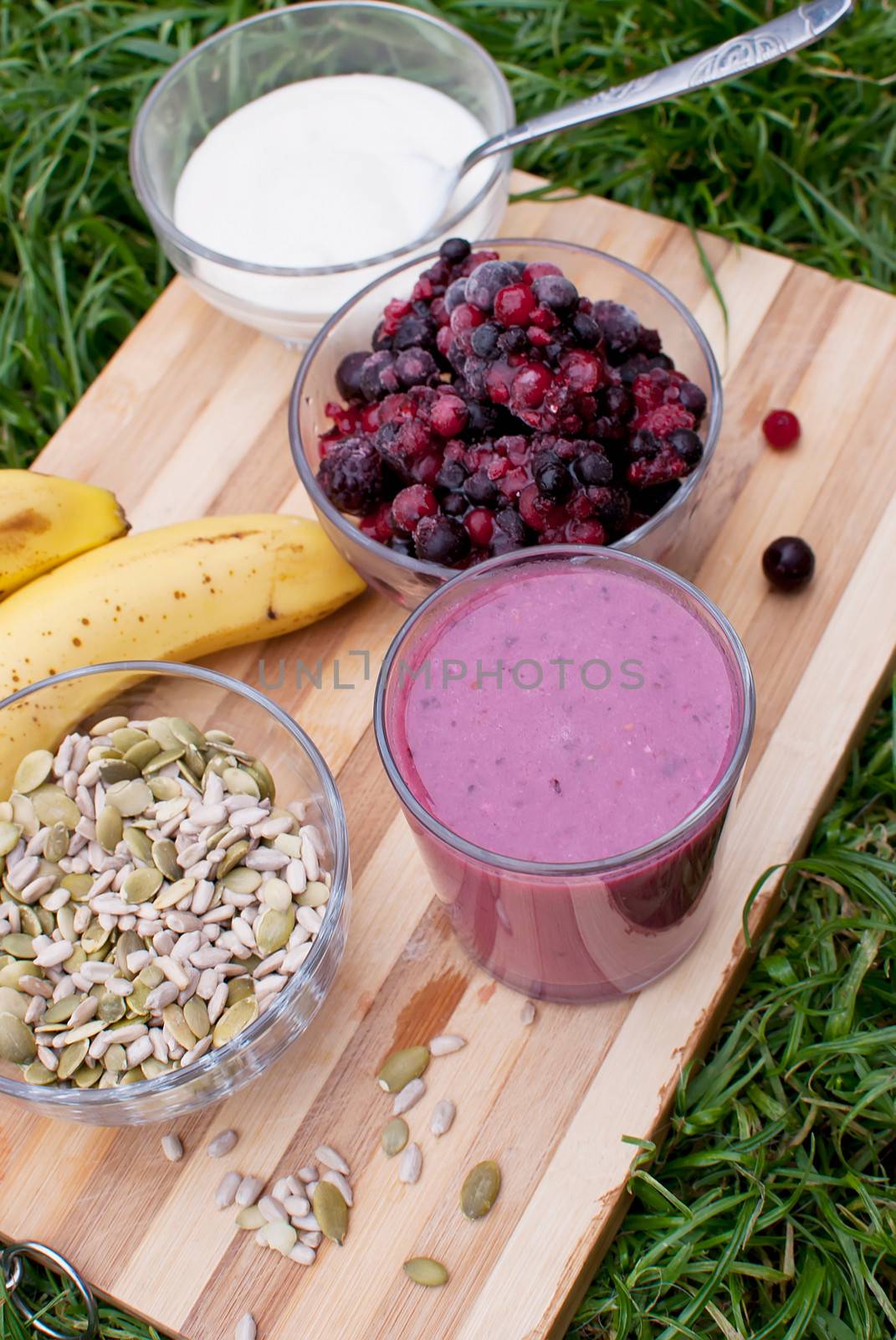 healthy berries juice smootie on wooden board