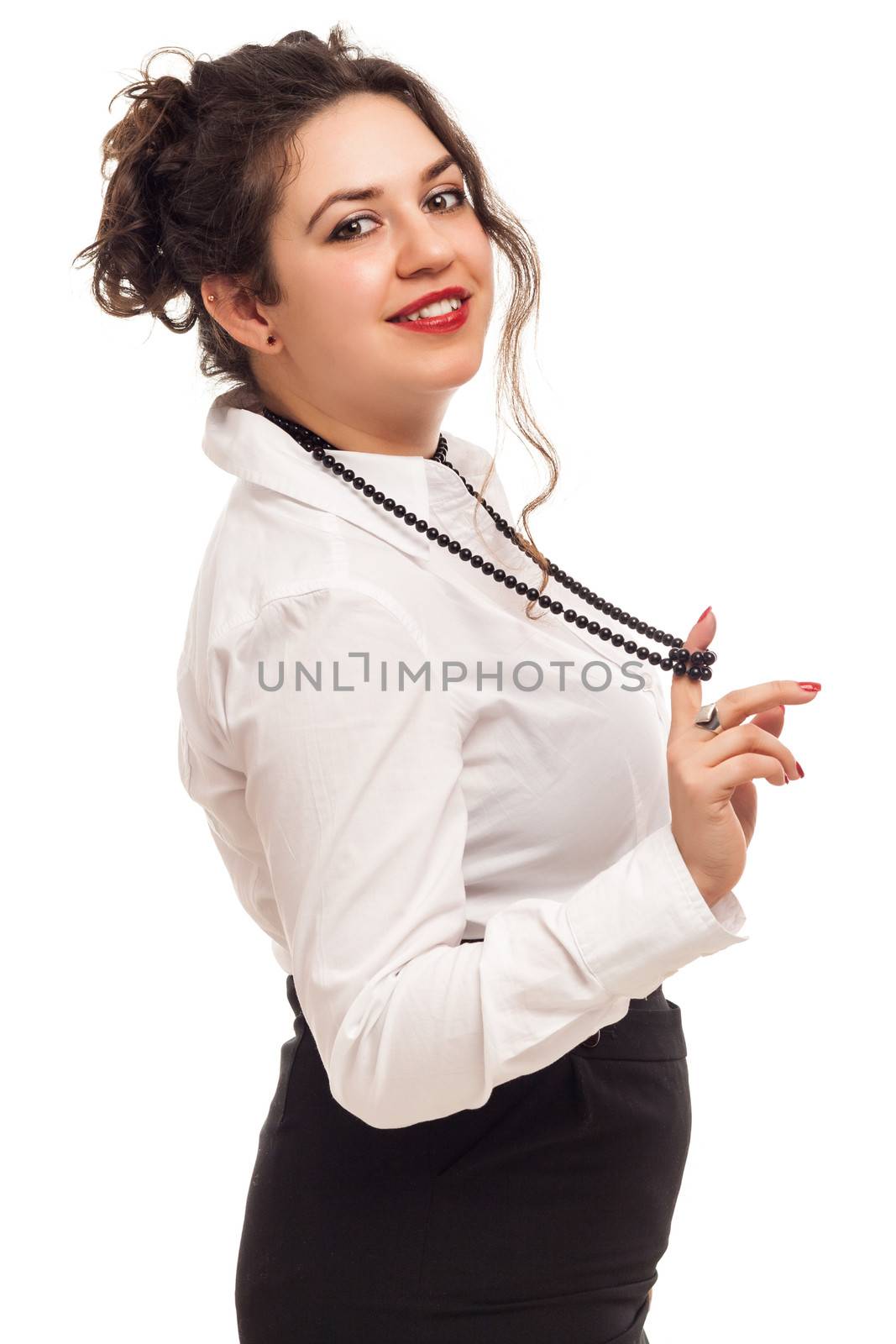 confident woman playing with necklace on white background